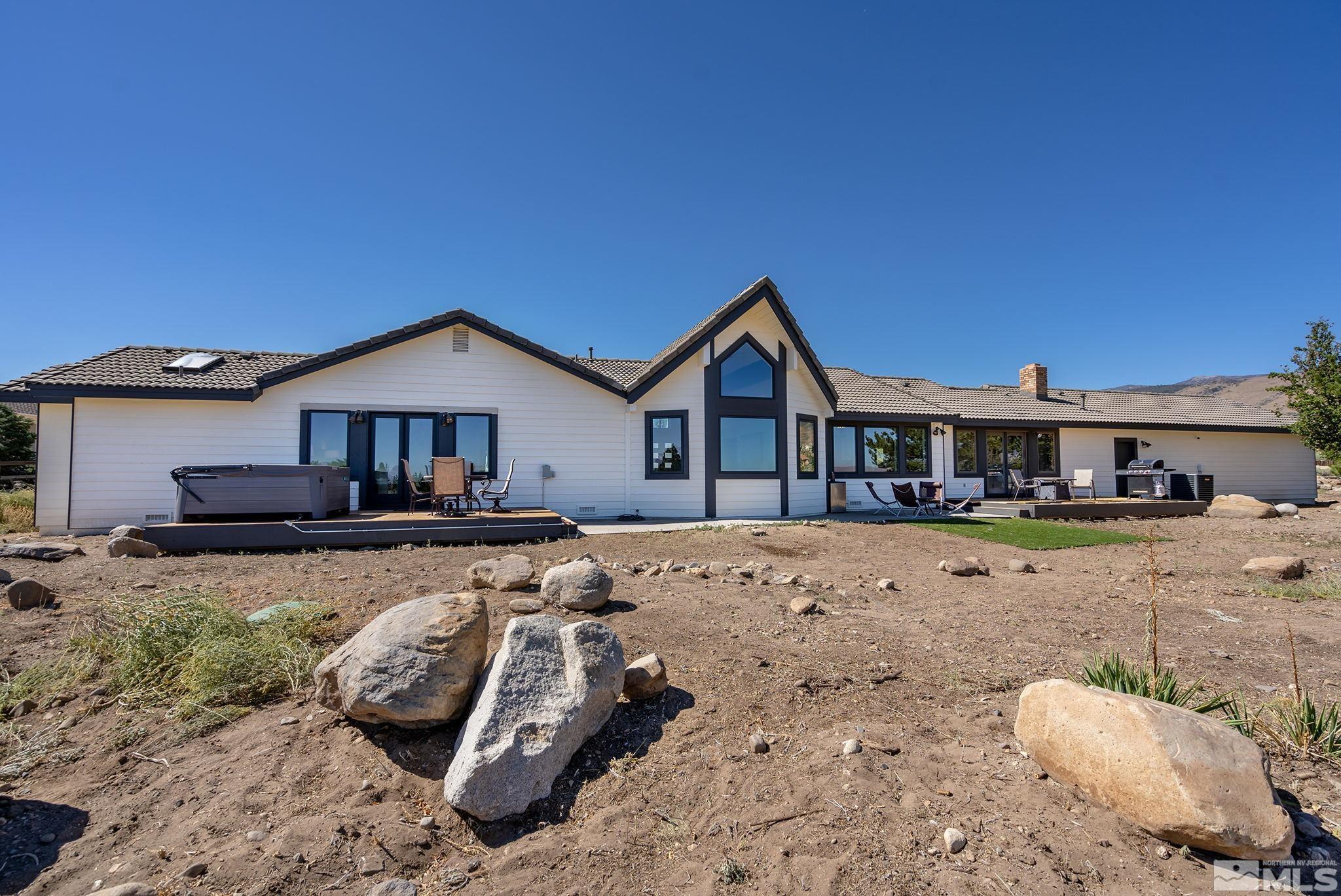 13285 Welcome Way Reno, NV 89511 - Photo 29 of 38 a front view of a house with a yard