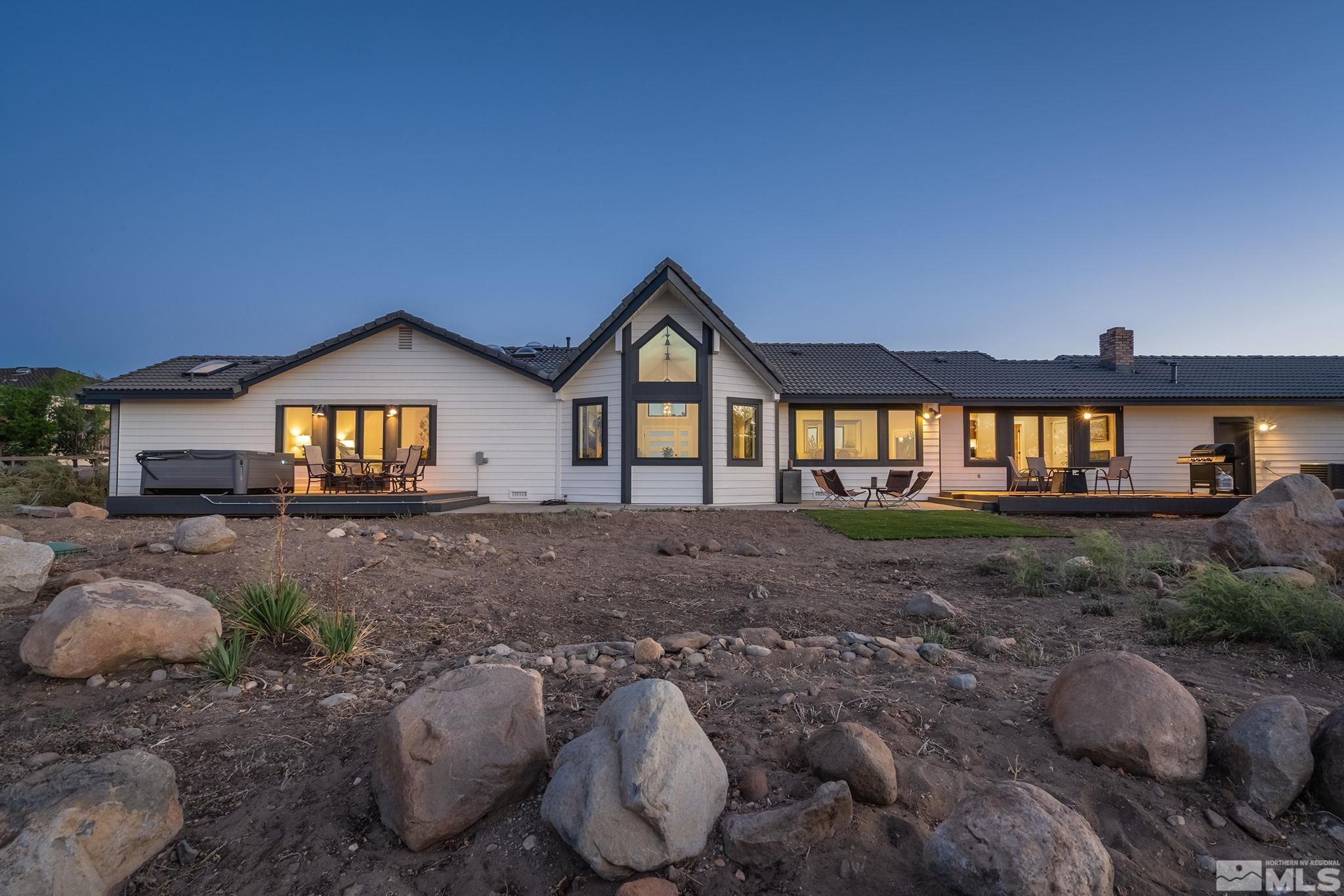 13285 Welcome Way Reno, NV 89511 - Photo 31 of 38 a front view of a house with a yard