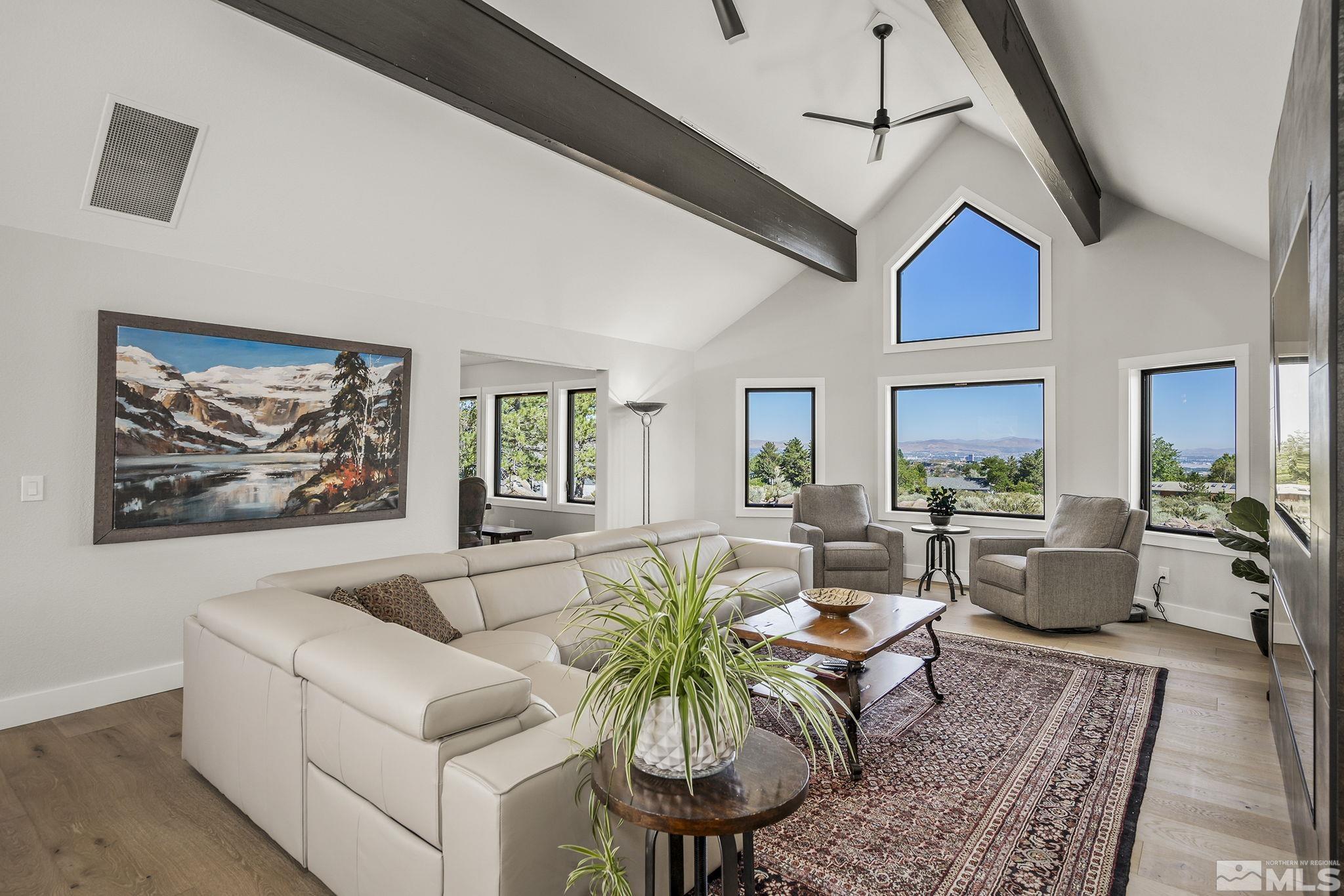 13285 Welcome Way Reno, NV 89511 - Photo 5 of 38 a living room with furniture ceiling fan and a rug