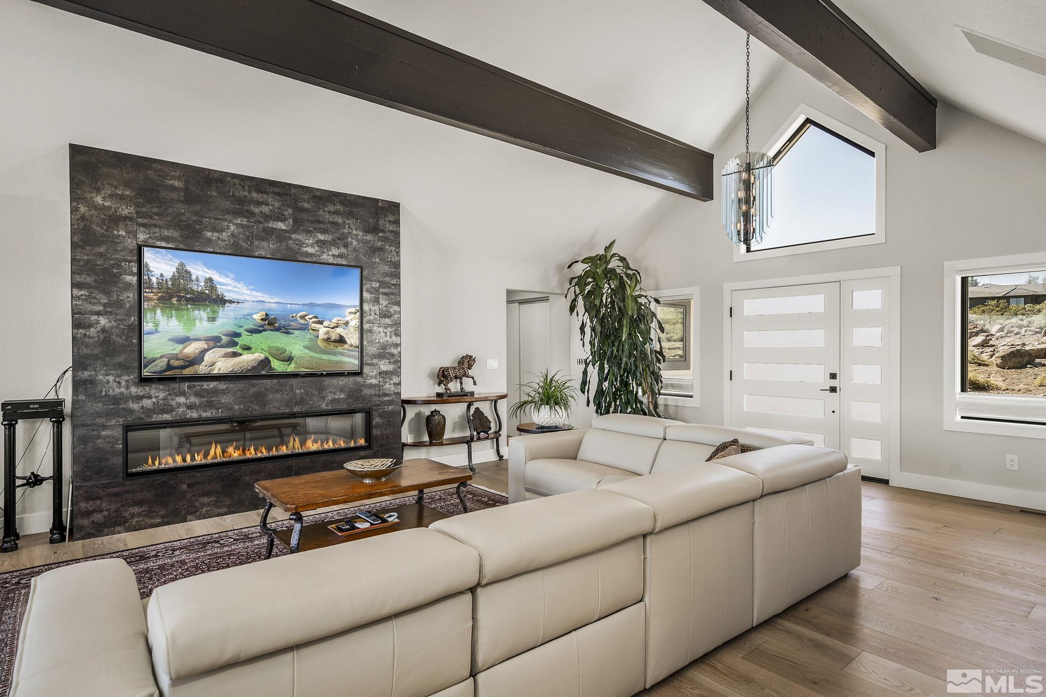 13285 Welcome Way Reno, NV 89511 - Photo 6 of 38 a living room with furniture and a flat screen tv