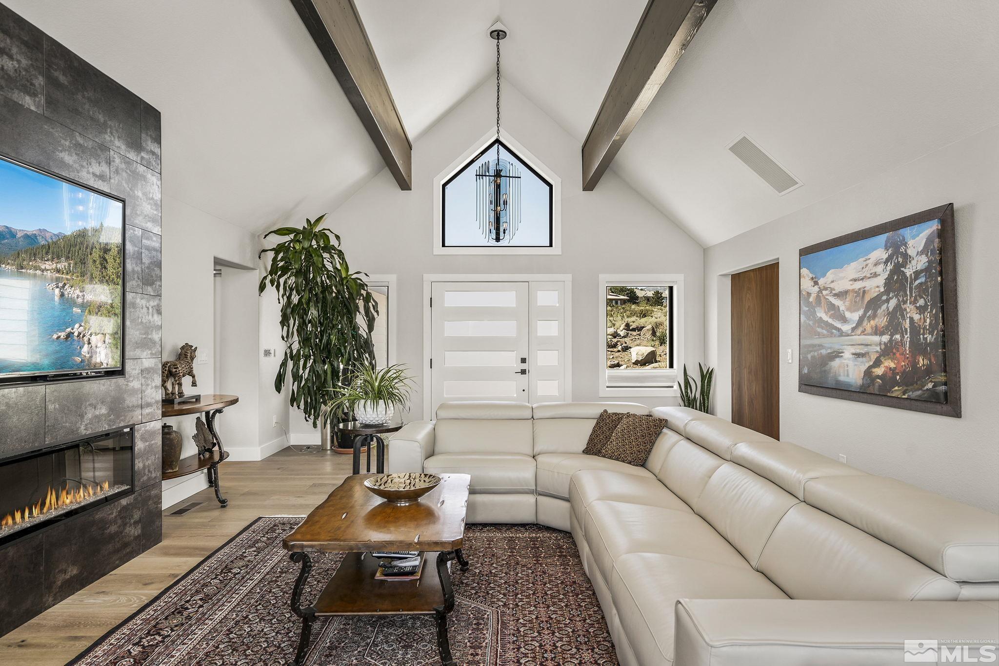 13285 Welcome Way Reno, NV 89511 - Photo 7 of 38 a living room with furniture and a fireplace