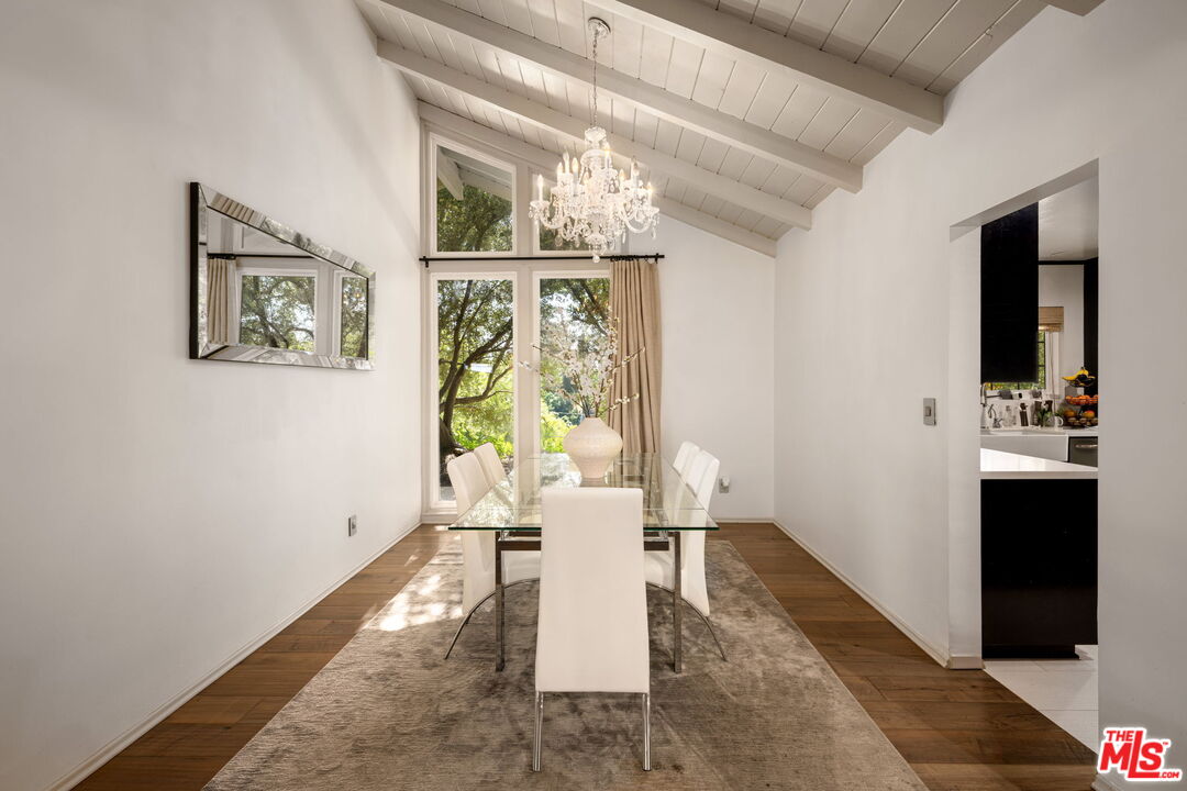 25021 Jim Bridger Road Hidden Hills, CA 91302 - Photo 11 of 30 a living room with furniture and a window