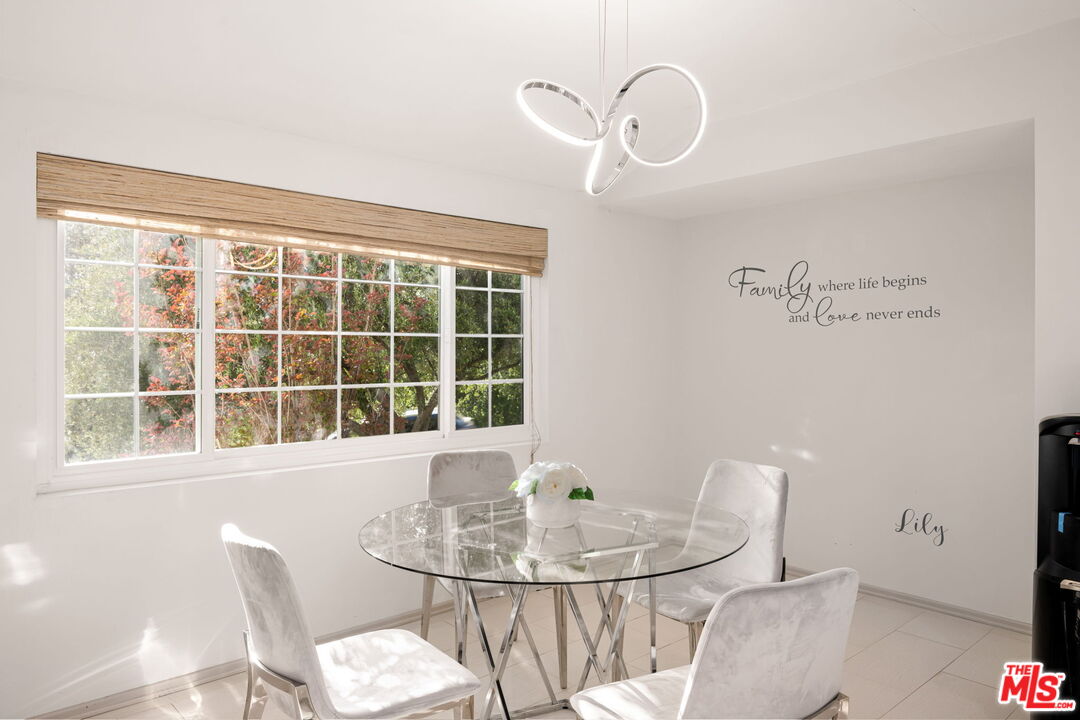 25021 Jim Bridger Road Hidden Hills, CA 91302 - Photo 15 of 30 a view of a dining room with furniture window and outside view