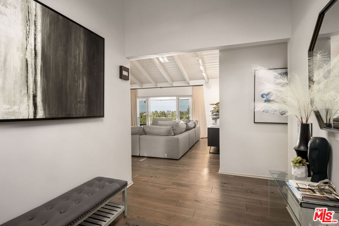 25021 Jim Bridger Road Hidden Hills, CA 91302 - Photo 2 of 30 a living room with furniture and a couch