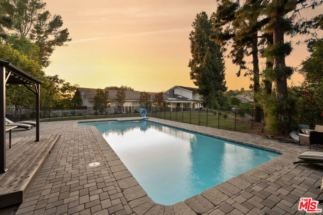 25021 Jim Bridger Road Hidden Hills, CA 91302 - Photo 22 of 30 a view of swimming pool with chairs