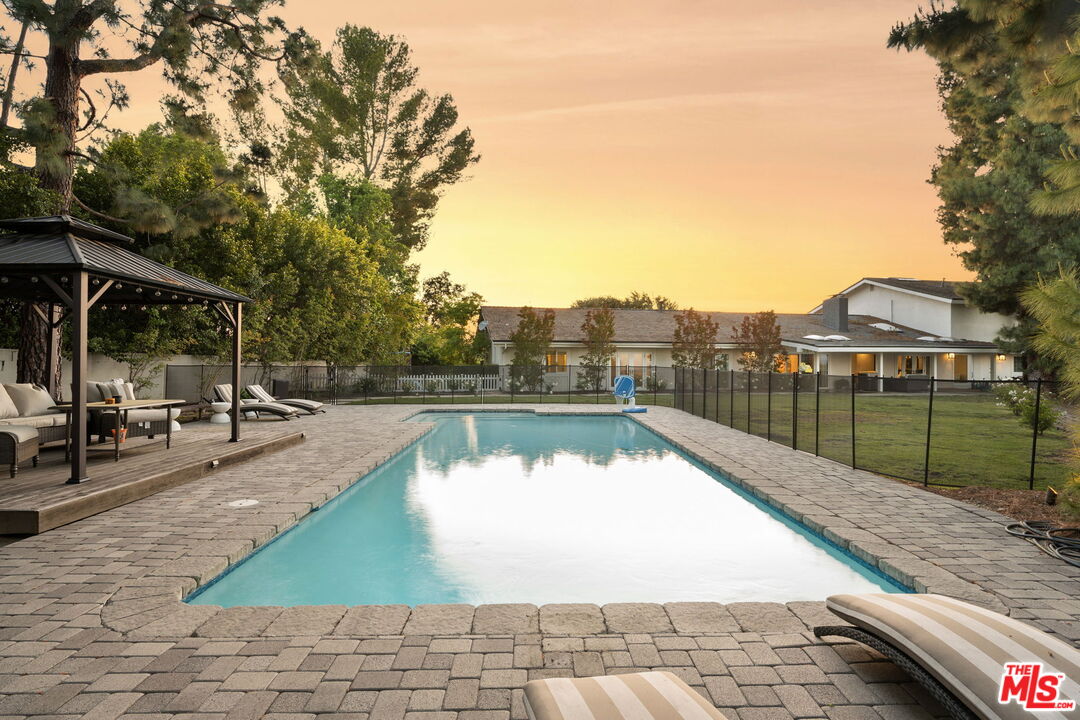25021 Jim Bridger Road Hidden Hills, CA 91302 - Photo 23 of 30 a view of swimming pool with a patio