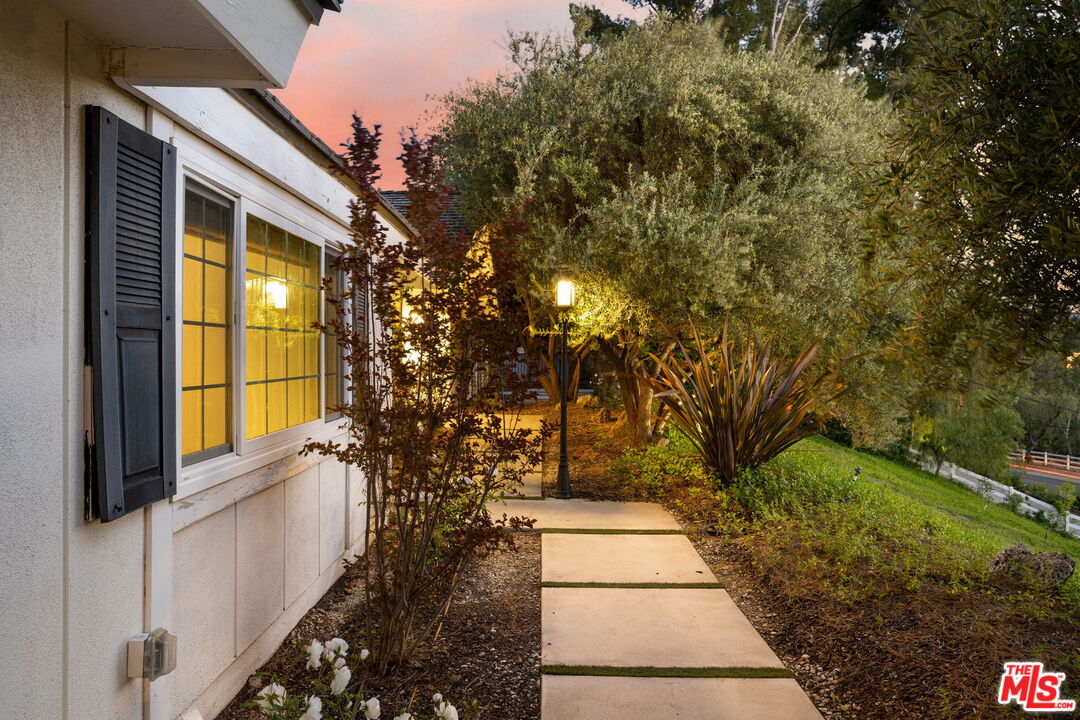25021 Jim Bridger Road Hidden Hills, CA 91302 - Photo 30 of 30 a view of a pathway of a house with a yard