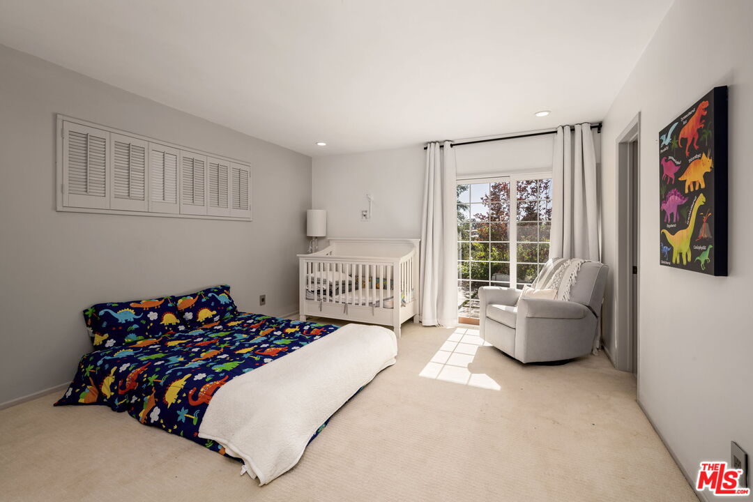 25021 Jim Bridger Road Hidden Hills, CA 91302 - Photo 9 of 30 a bed sitting in a bedroom next to a window