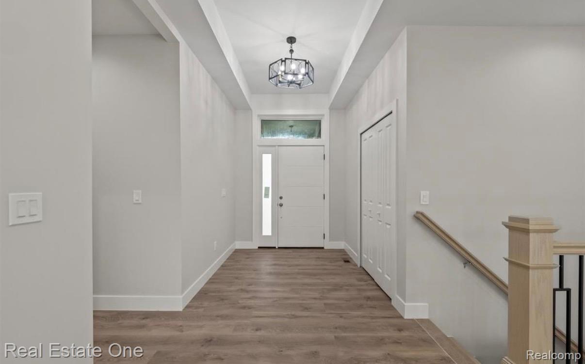 5636 Paris Street Sterling Heights, MI 48310 - Photo 14 of 37 Entryway featuring wood finished floors and suspended lighting