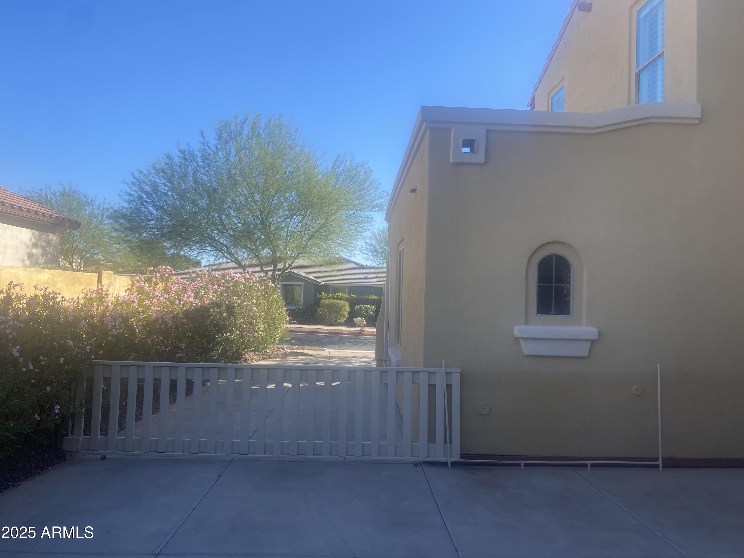 2946 North Beverly Place Buckeye, AZ 85396 - Photo 38 of 61 EXTENDED DRIVEWAY WITH GATE