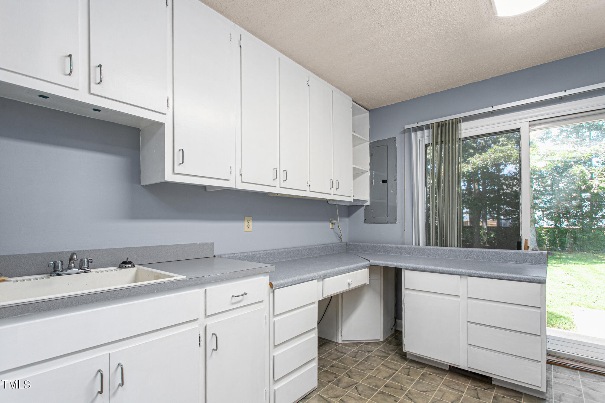 809 Brookview Drive Elon, NC 27244 - Photo 20 of 53 a kitchen with granite countertop white cabinets and a sink