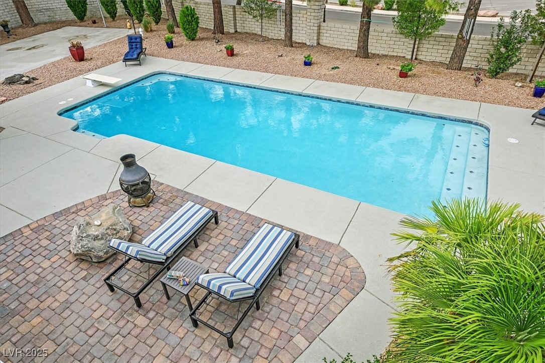 18 Hummingbird Circle Henderson, NV 89014 - Photo 18 of 39 View of pool with a patio area, a fenced backyard, and a diving board