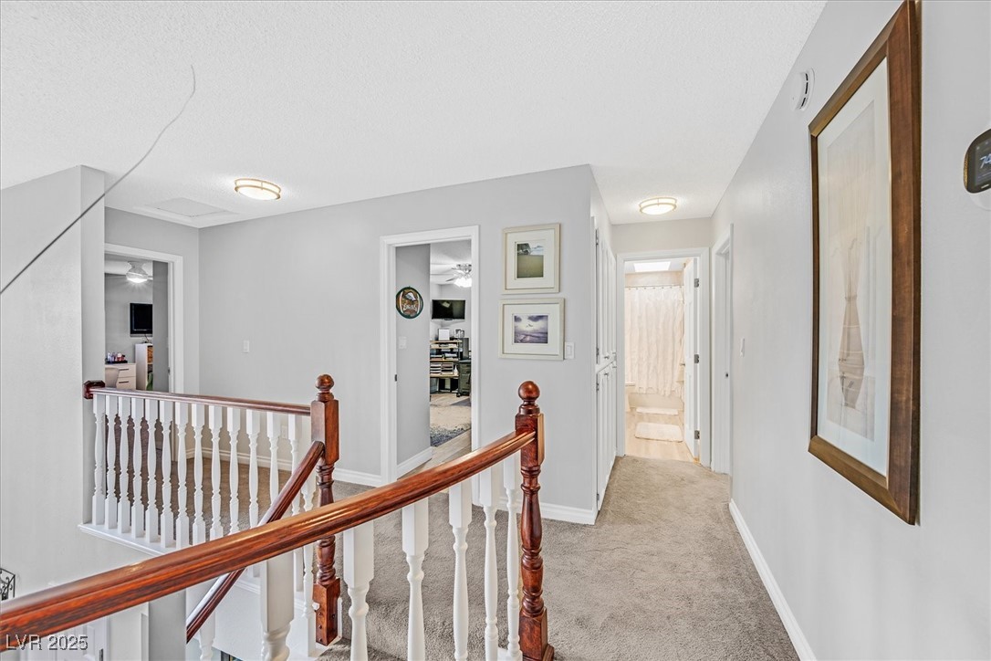 18 Hummingbird Circle Henderson, NV 89014 - Photo 23 of 39 Corridor featuring an upstairs landing and light carpet