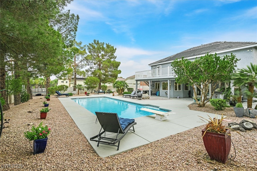 18 Hummingbird Circle Henderson, NV 89014 - Photo 33 of 39 Outdoor pool with a patio area, a diving board, and a balcony