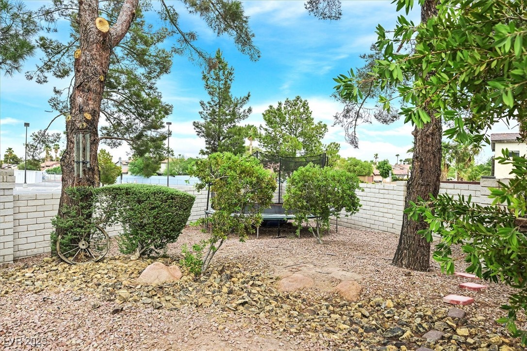 18 Hummingbird Circle Henderson, NV 89014 - Photo 34 of 39 Fenced backyard featuring a trampoline