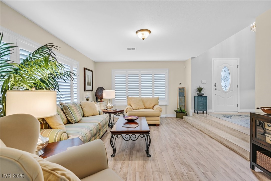 18 Hummingbird Circle Henderson, NV 89014 - Photo 5 of 39 Living room with wood finished floors and baseboards