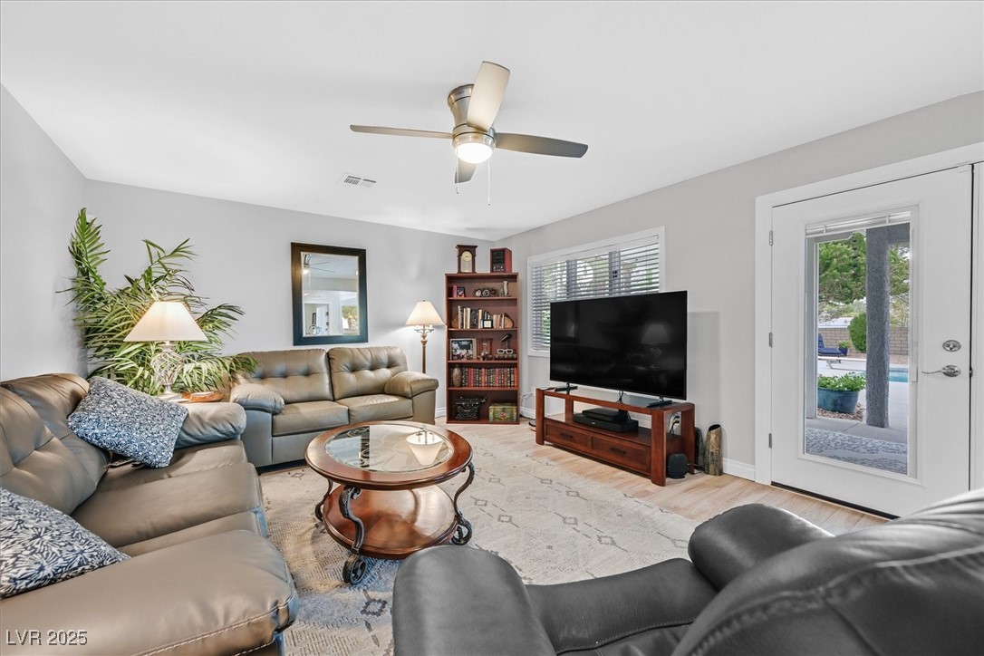 18 Hummingbird Circle Henderson, NV 89014 - Photo 10 of 39 Living room with wood finished floors and a ceiling fan