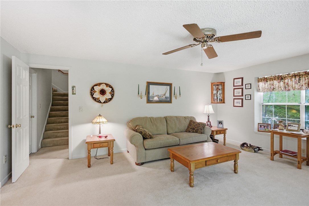 6 Tradewinds Way Salem, SC 29676 - Photo 19 of 50 This inviting living space features carpeted flooring and a convenient ceiling fan for comfort.