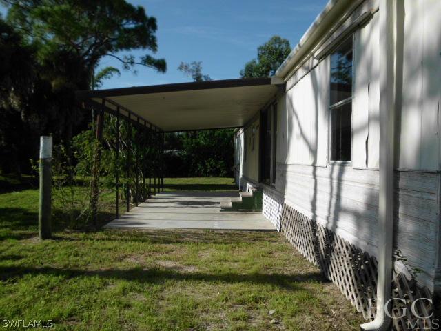 7491 Pinehurst Road Bokeelia, FL 33922 - Photo 3 of 7 a view of outdoor space and deck