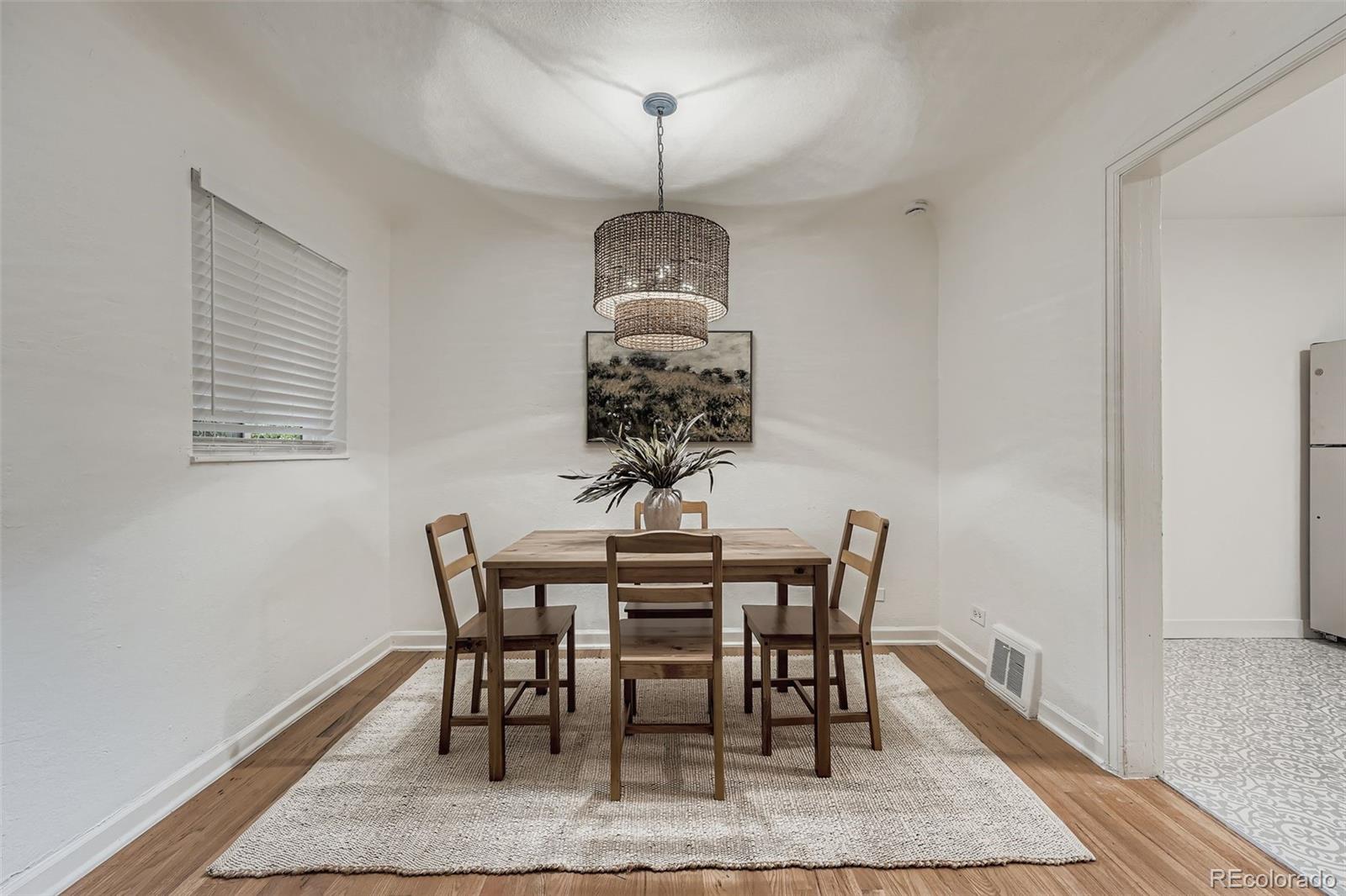 2985 Ivanhoe Street Denver, CO 80207 - Photo 7 of 25 a dining room with furniture and window