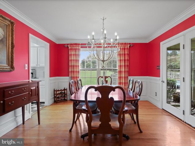 a bedroom with a bed and a television