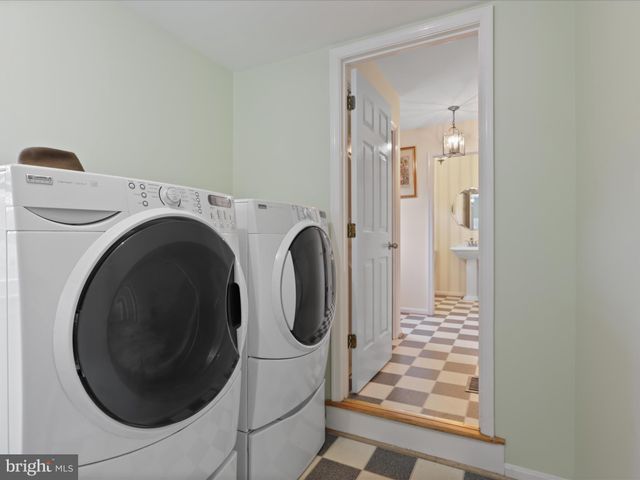 a view of a house with swimming pool and porch