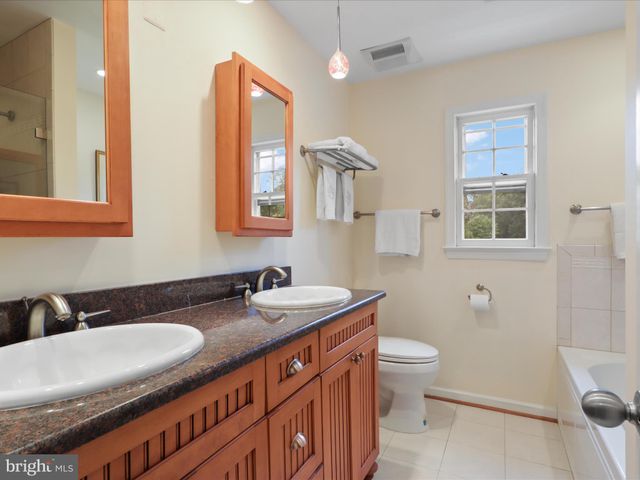 a view of a house with outdoor seating area