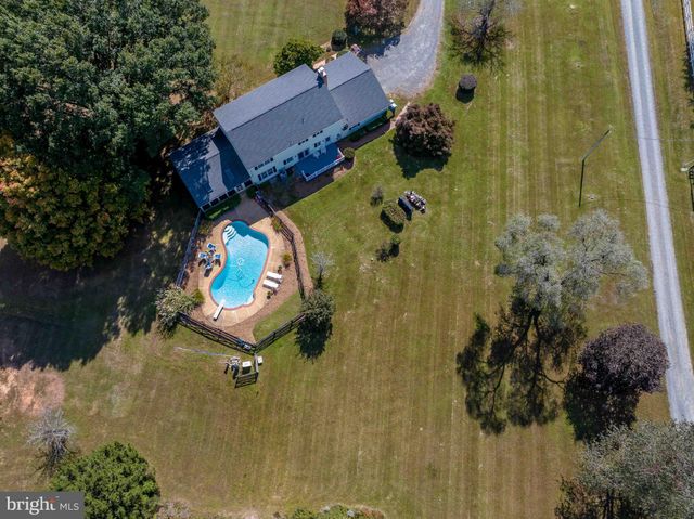 a view of a hallway with closet and cabinet