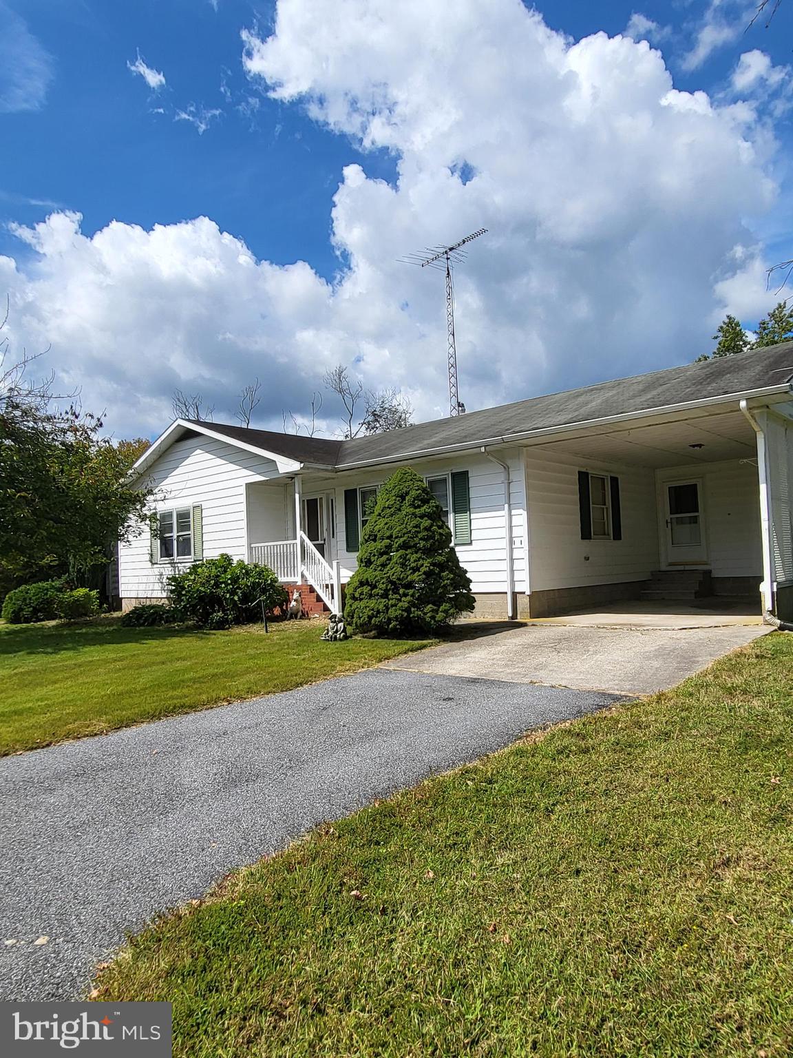 2189 Judith Road Hartly, DE 19953 - Photo 21 of 26 a front view of a house with a yard and garage