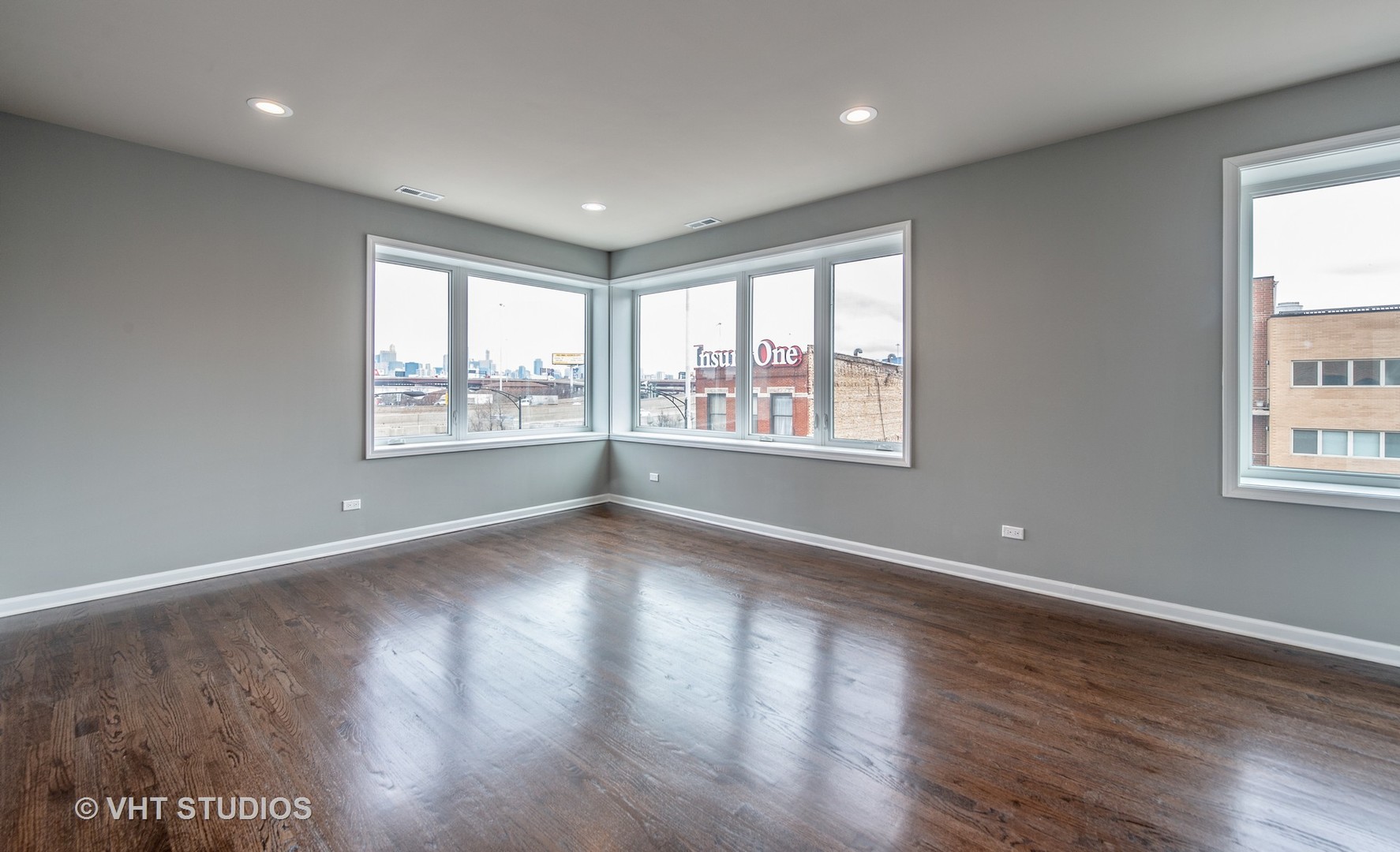 2606 South Halsted Street, Unit 2N Chicago, IL 60608 - Photo 3 of 10 a view of an empty room with wooden floor and a window