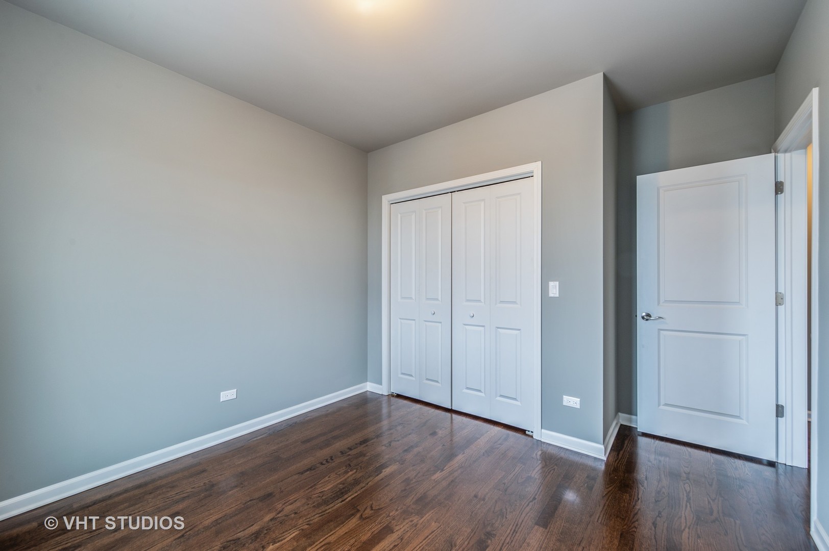 2606 South Halsted Street, Unit 2N Chicago, IL 60608 - Photo 9 of 10 a view of an empty room with wooden floor