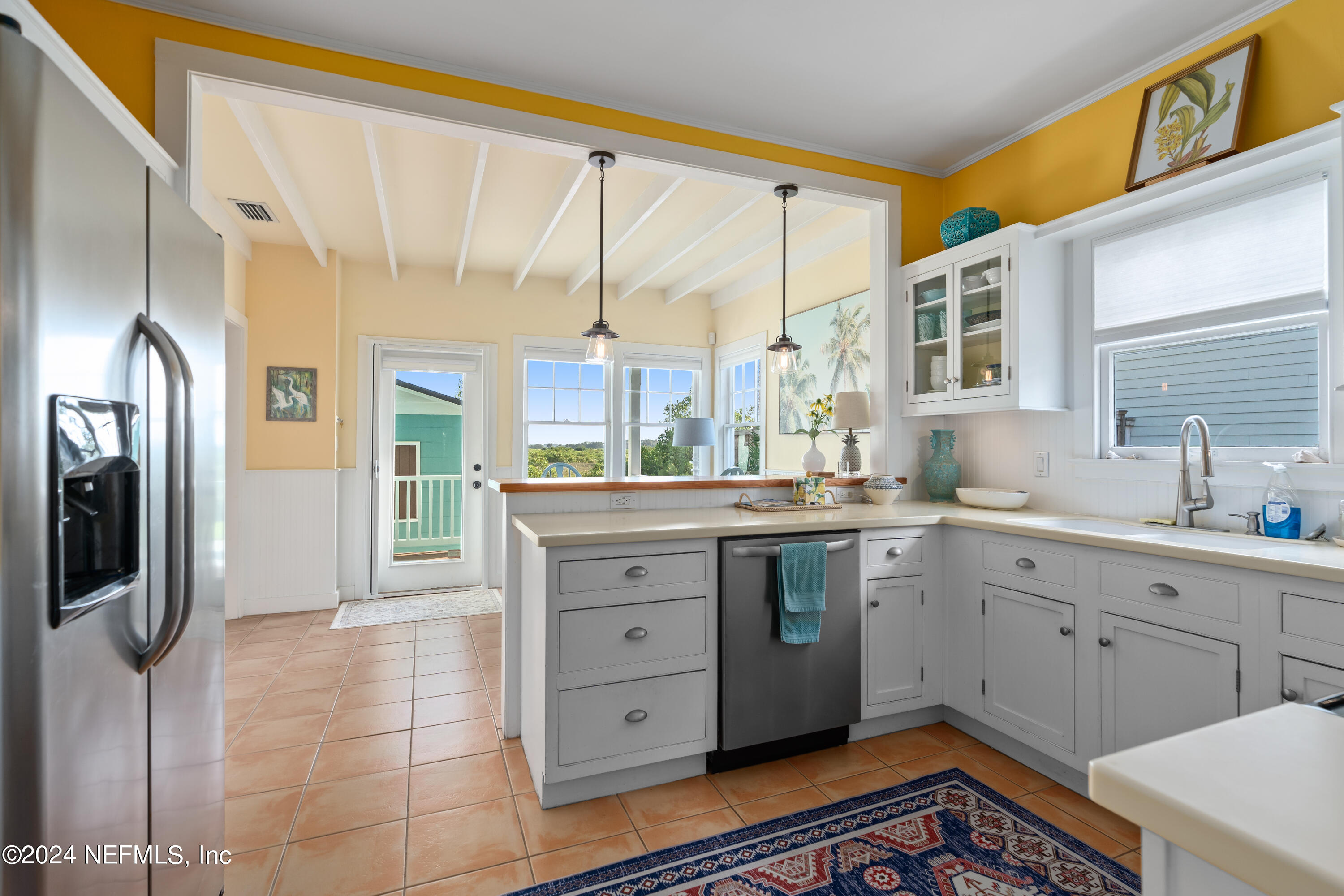 34 Park Avenue St. Augustine, FL 32084 - Photo 13 of 37 a large bathroom with a large mirror vanity and shower