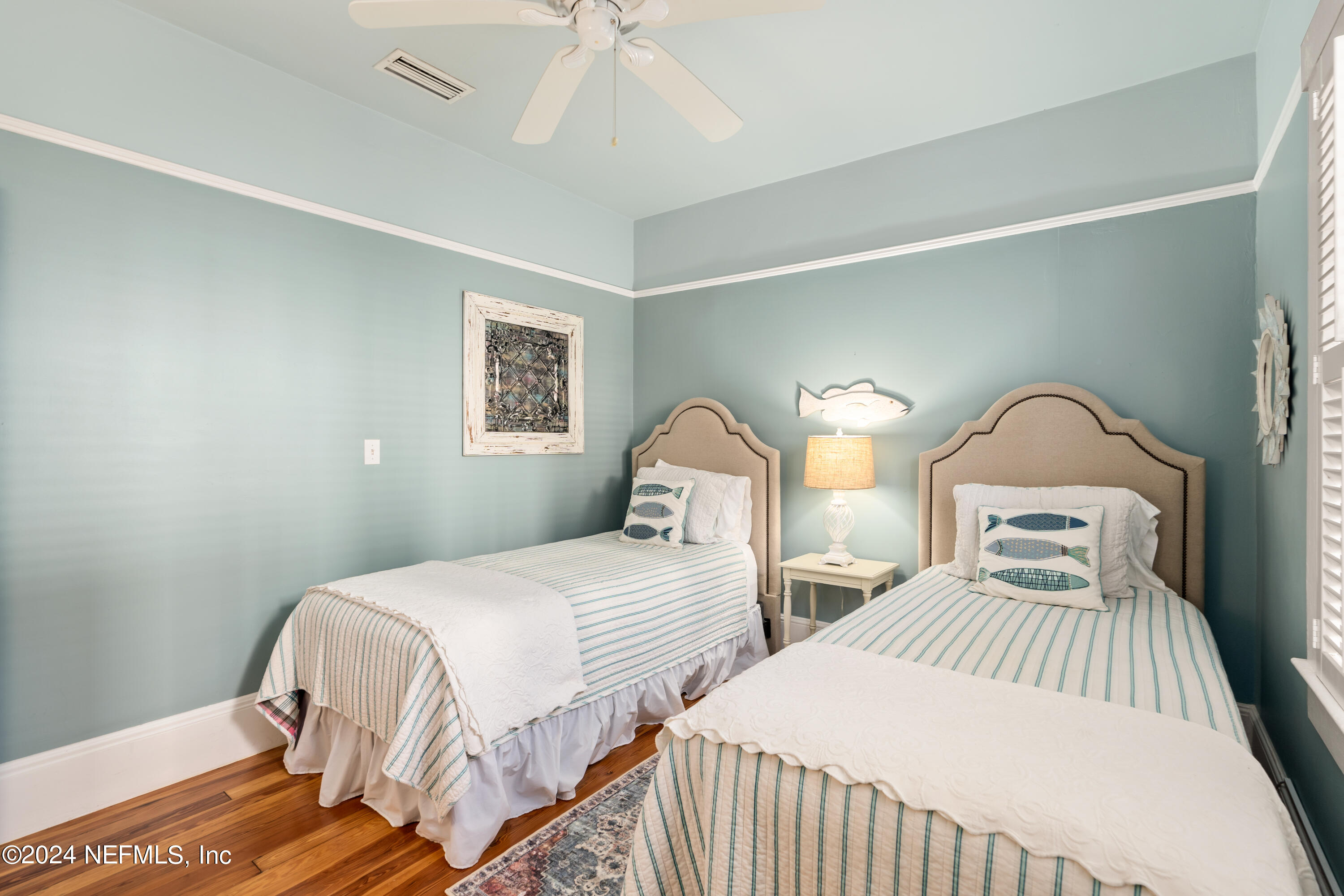 34 Park Avenue St. Augustine, FL 32084 - Photo 20 of 37 a bedroom with two beds and a chandelier