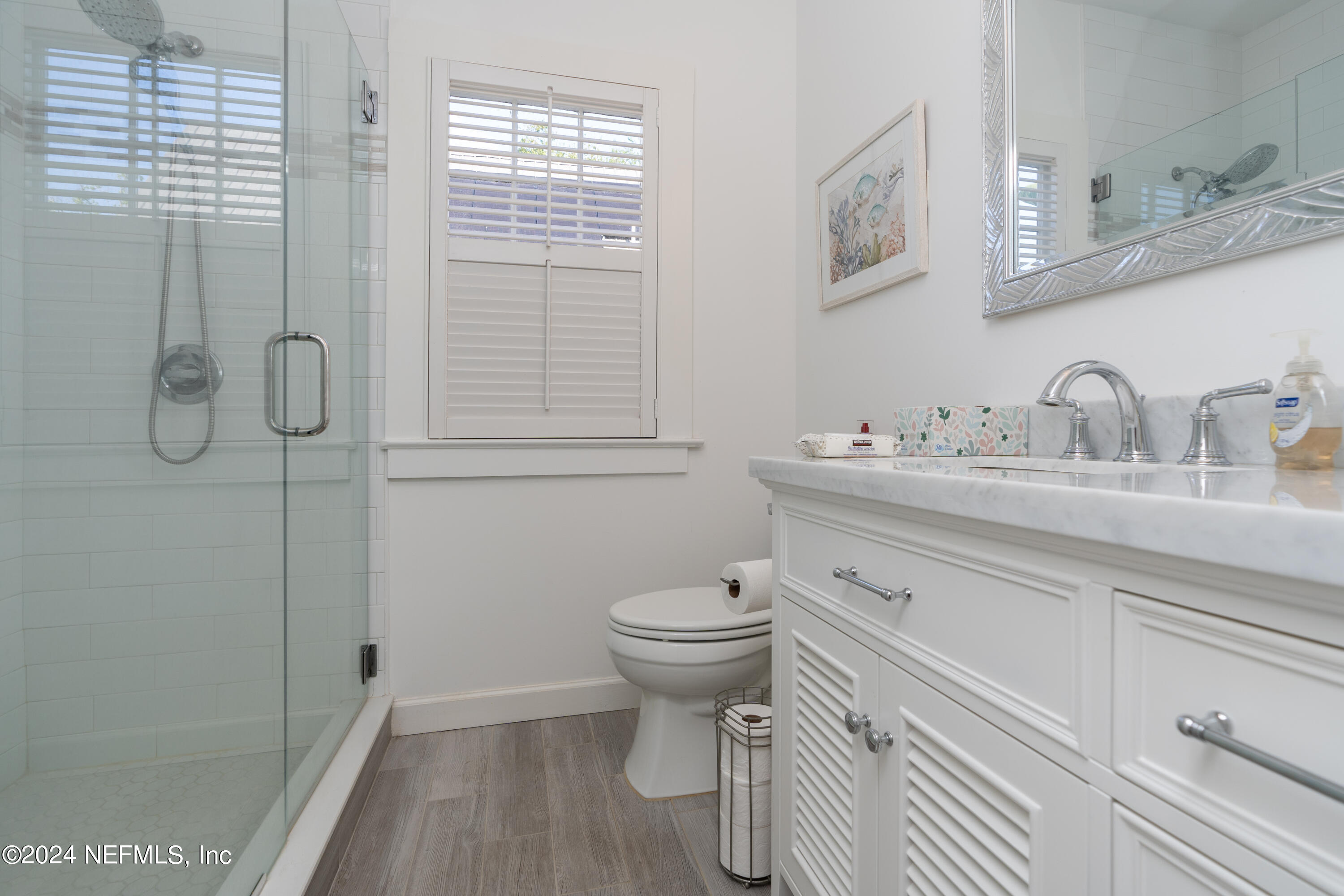34 Park Avenue St. Augustine, FL 32084 - Photo 23 of 37 a bathroom with a sink a toilet and shower