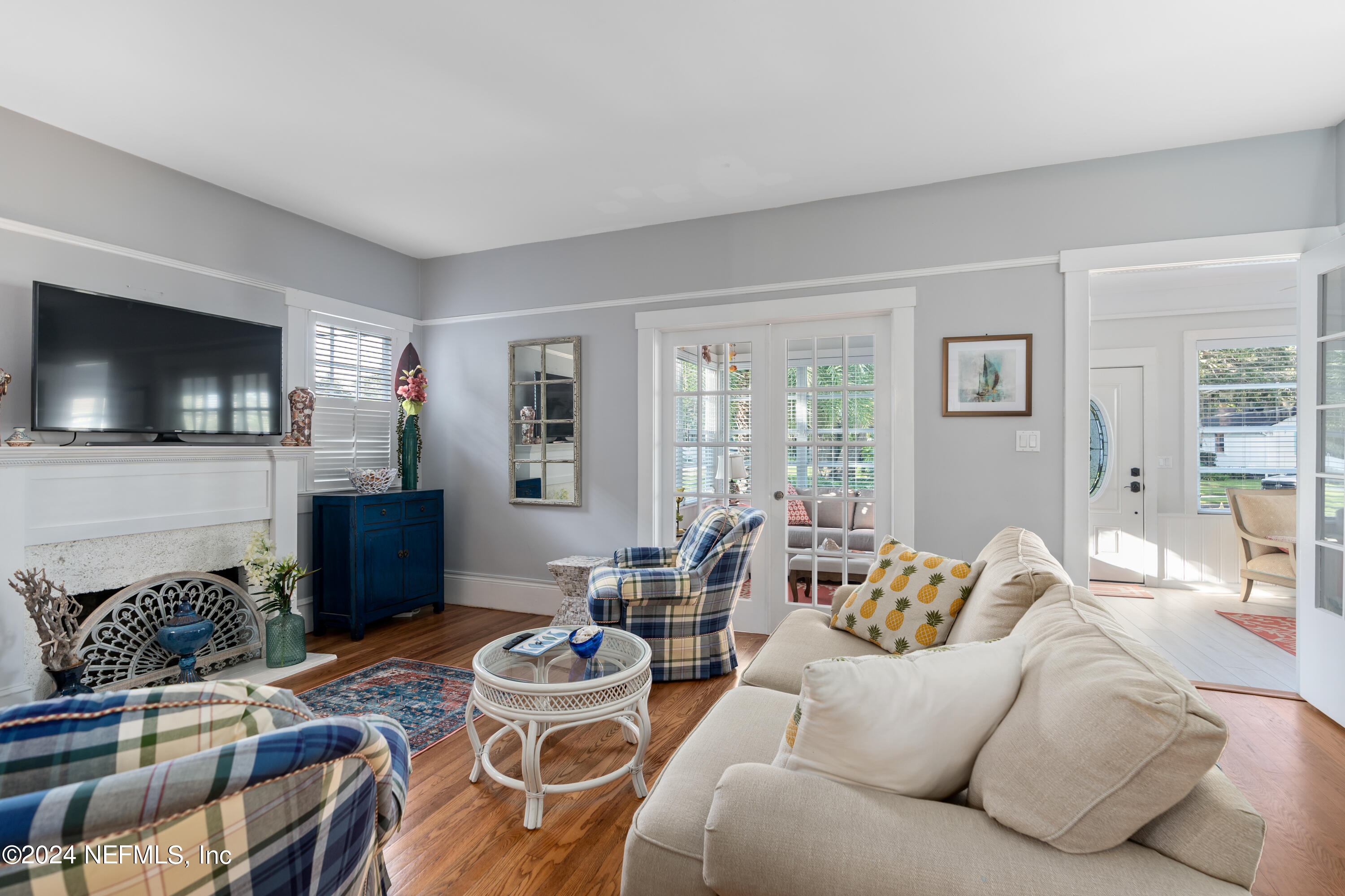 34 Park Avenue St. Augustine, FL 32084 - Photo 9 of 37 a living room with furniture and a flat screen tv
