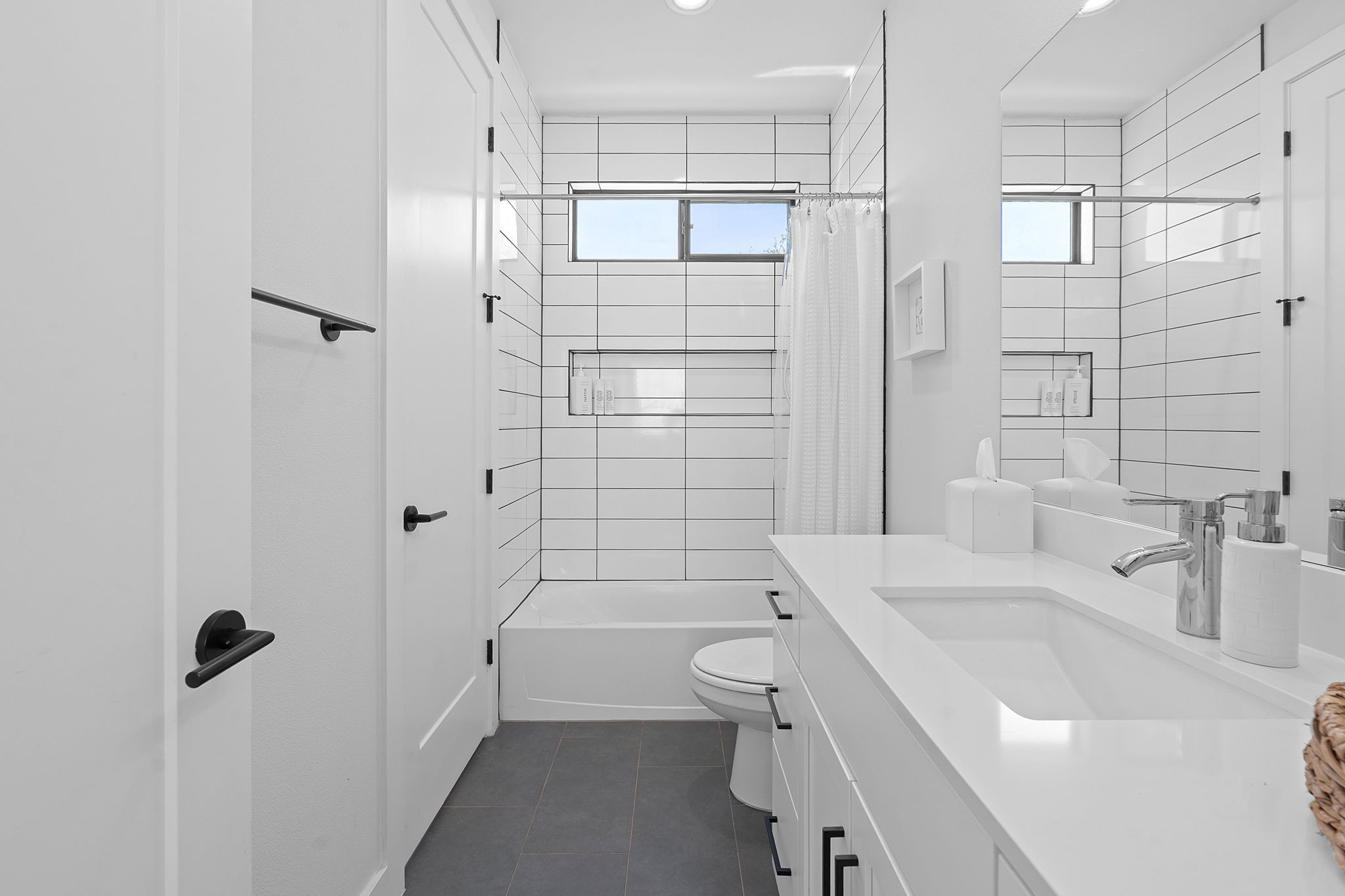 1168 Ridgeway Drive, Unit 2 Austin, TX 78702 - Photo 17 of 25 a bathroom with a sink toilet and shower
