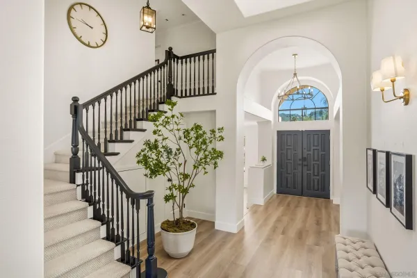 a view of entryway with wooden floor