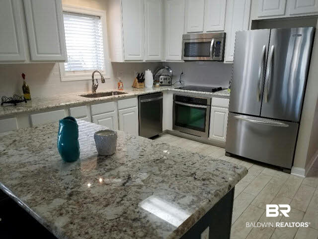 28875 Perdido Beach Boulevard, Unit 1A Orange Beach, AL 36561 - Photo 19 of 25 Beautiful Kitchen with SS appliances and New Granite