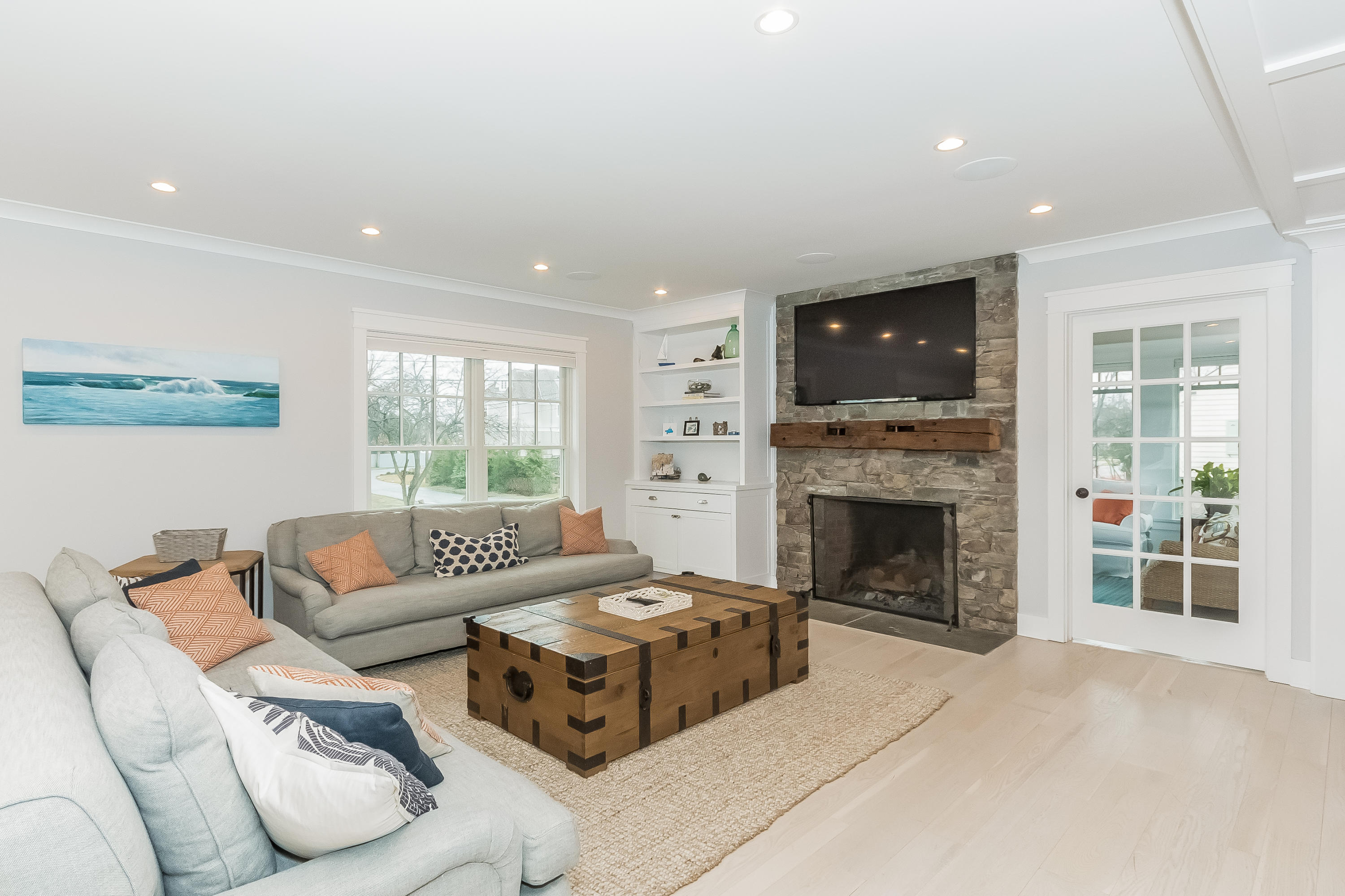 20 Plymouth Road Darien, CT 06820 - Photo 12 of 46 a living room with furniture a fireplace and a flat screen tv
