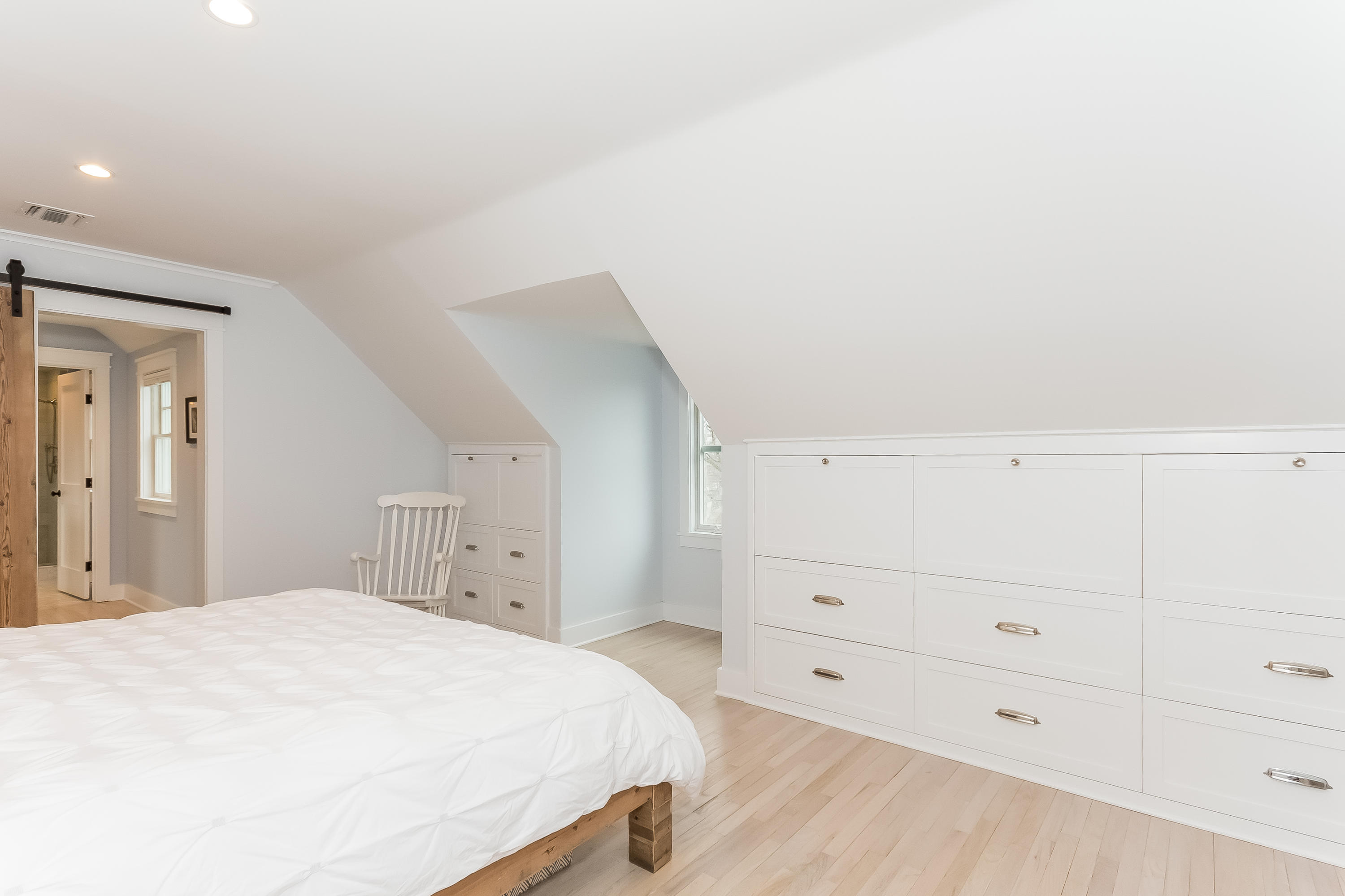 20 Plymouth Road Darien, CT 06820 - Photo 20 of 46 a spacious bedroom with a bed and cabinet