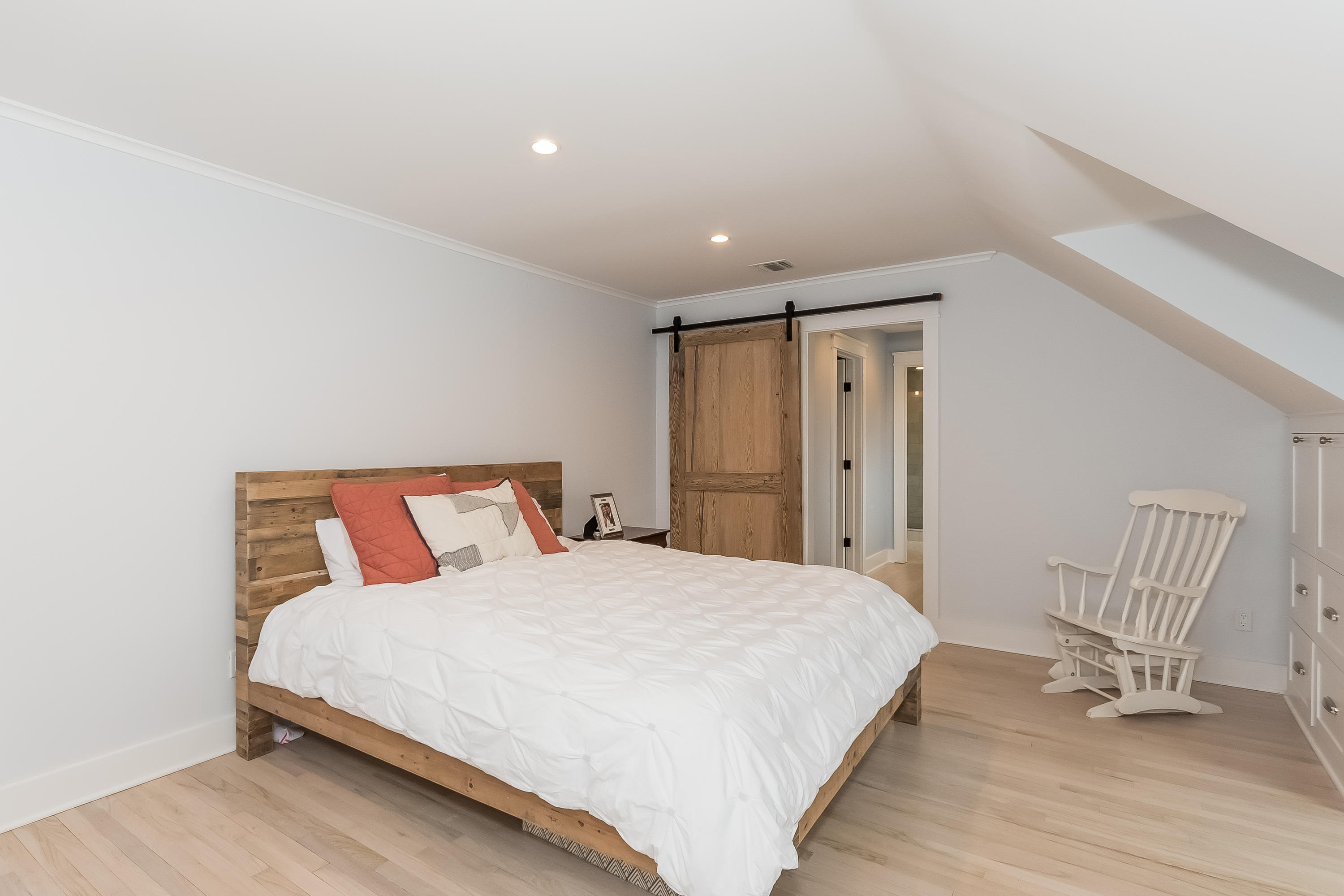 20 Plymouth Road Darien, CT 06820 - Photo 21 of 46 a spacious bedroom with a bed and chair