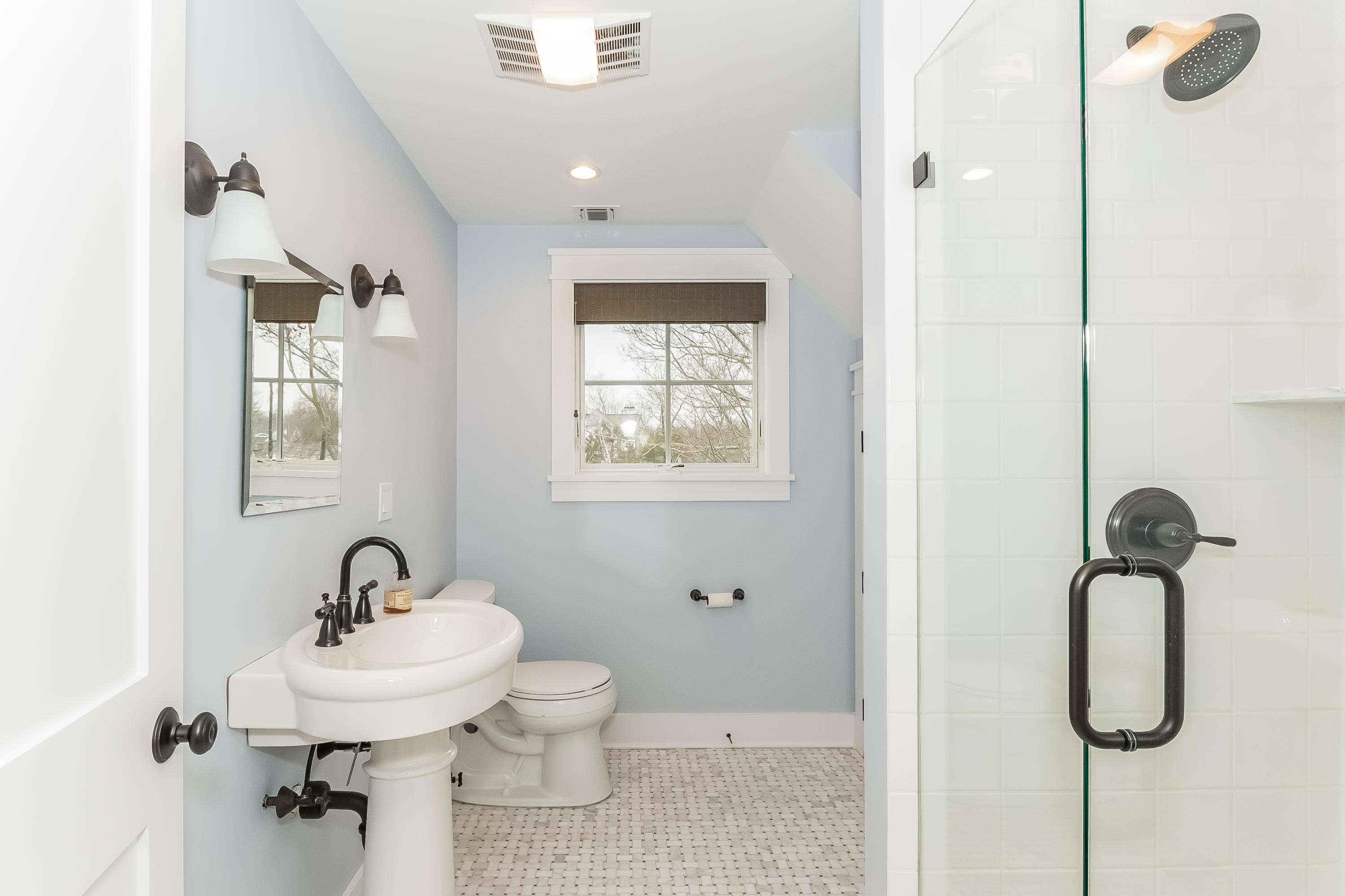20 Plymouth Road Darien, CT 06820 - Photo 29 of 46 a bathroom with a sink a toilet and a mirror
