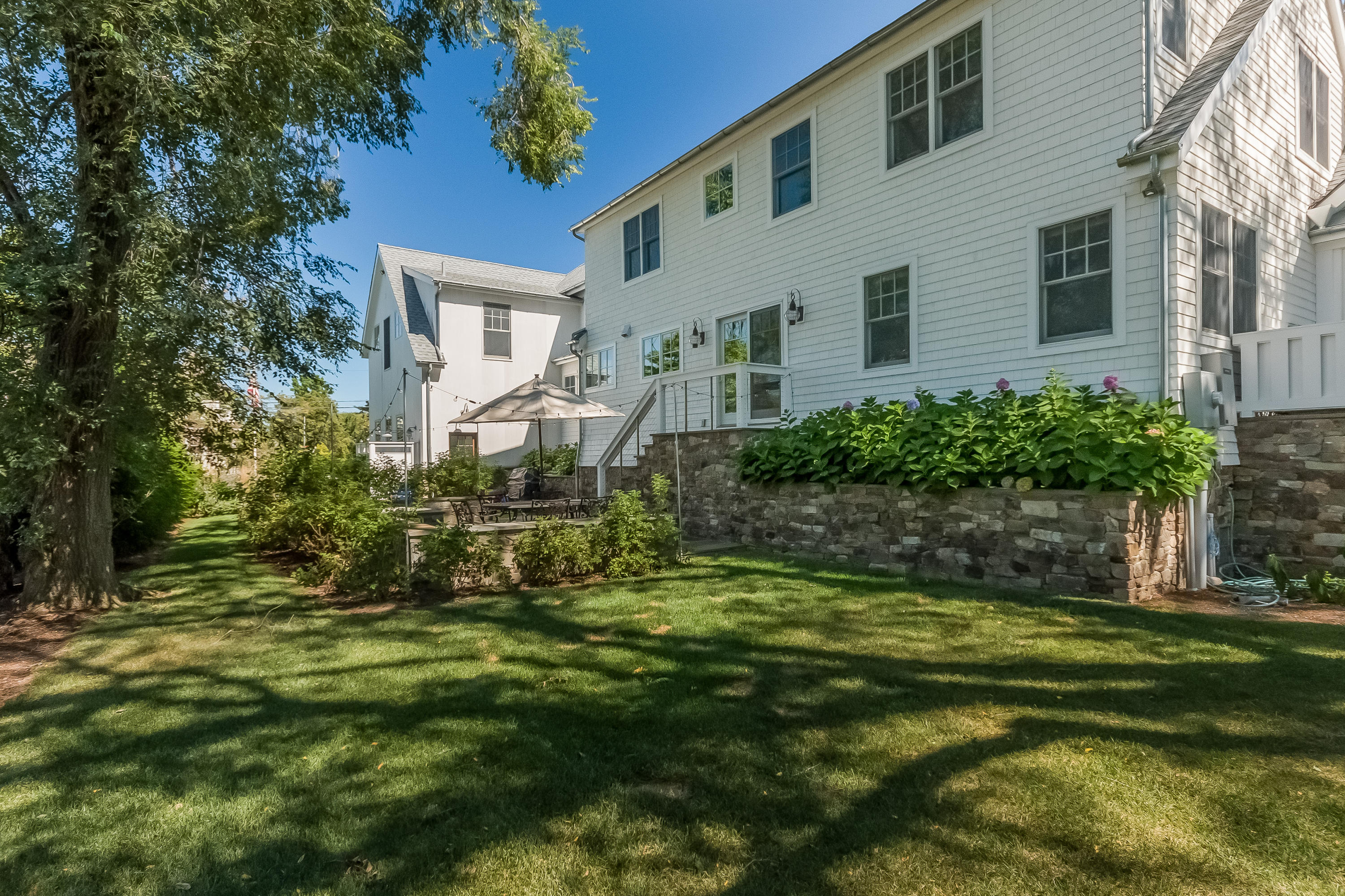 20 Plymouth Road Darien, CT 06820 - Photo 32 of 46 a view of a house with a yard