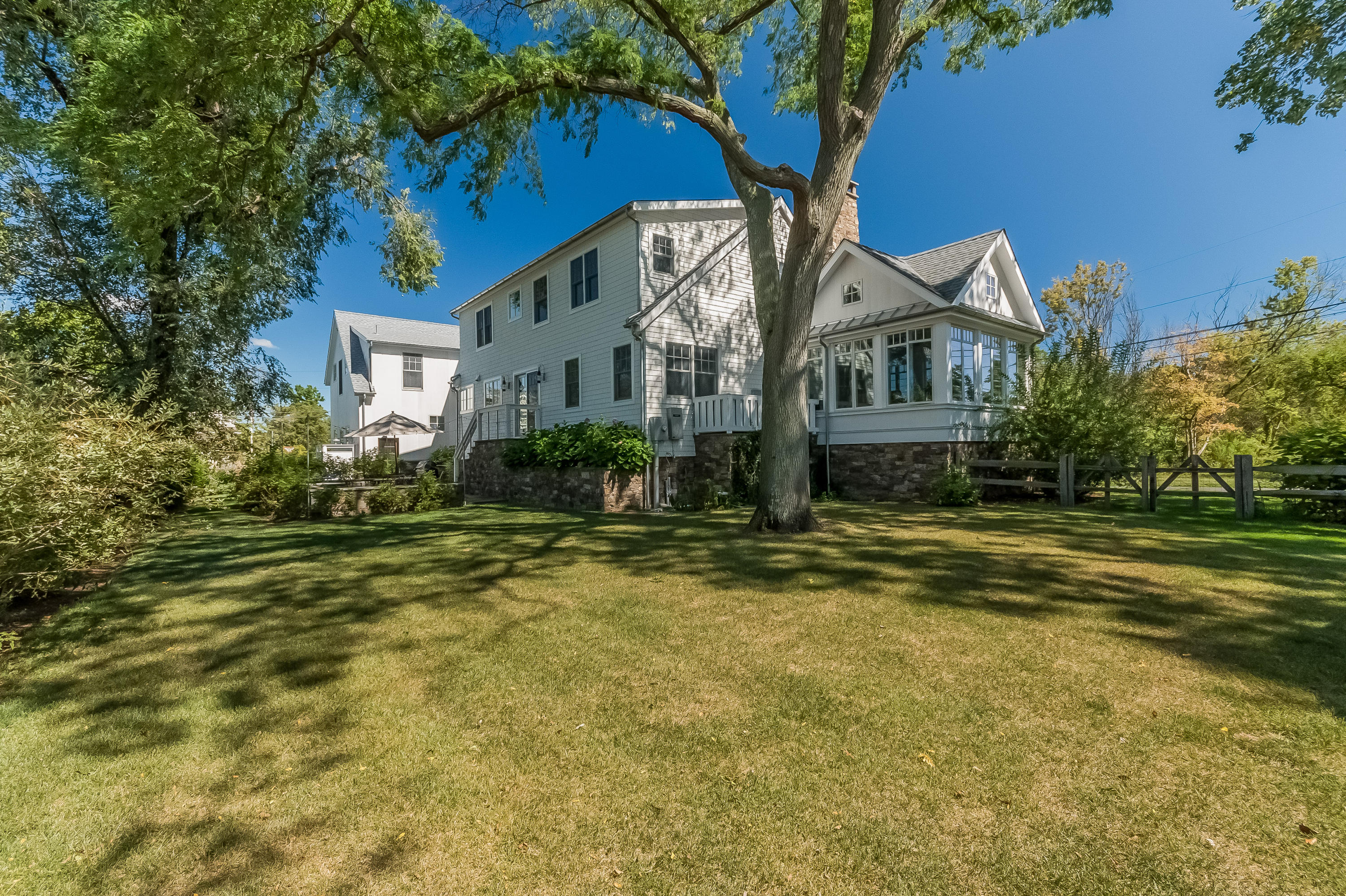 20 Plymouth Road Darien, CT 06820 - Photo 33 of 46 a front view of house with yard and trees