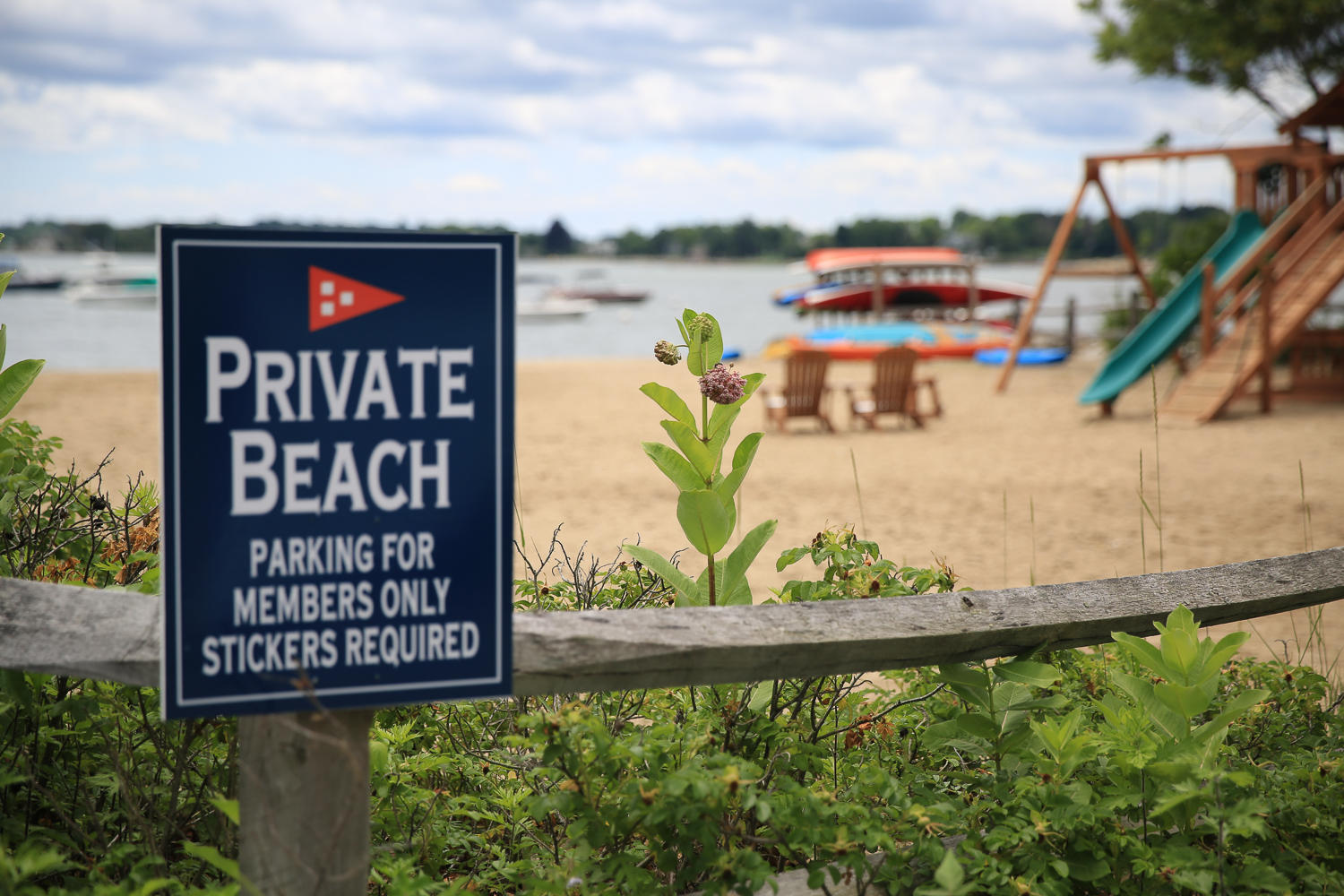 20 Plymouth Road Darien, CT 06820 - Photo 40 of 46 a view of a sign board with a lake view
