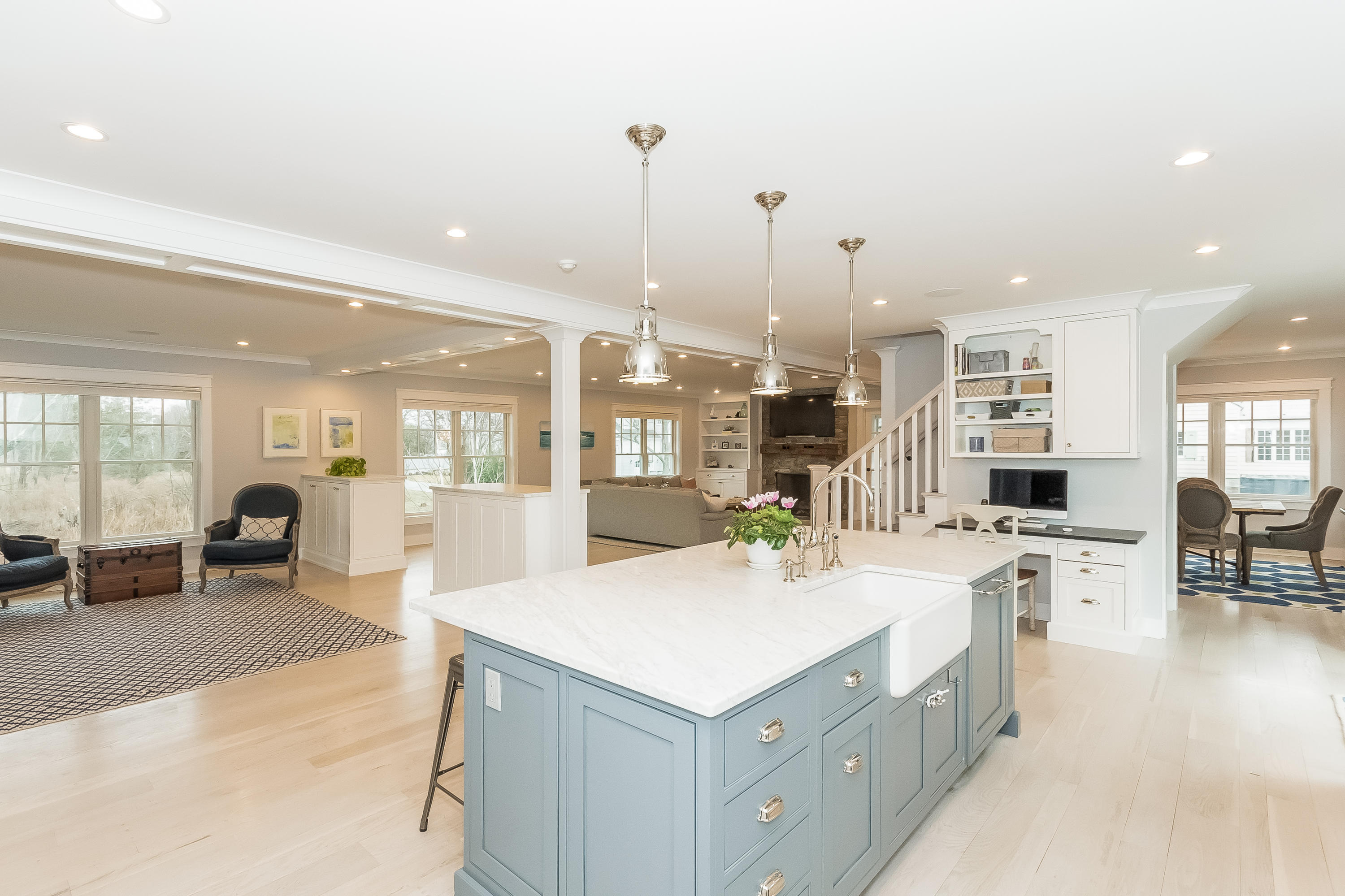 20 Plymouth Road Darien, CT 06820 - Photo 9 of 46 a large white kitchen with a large window and couch