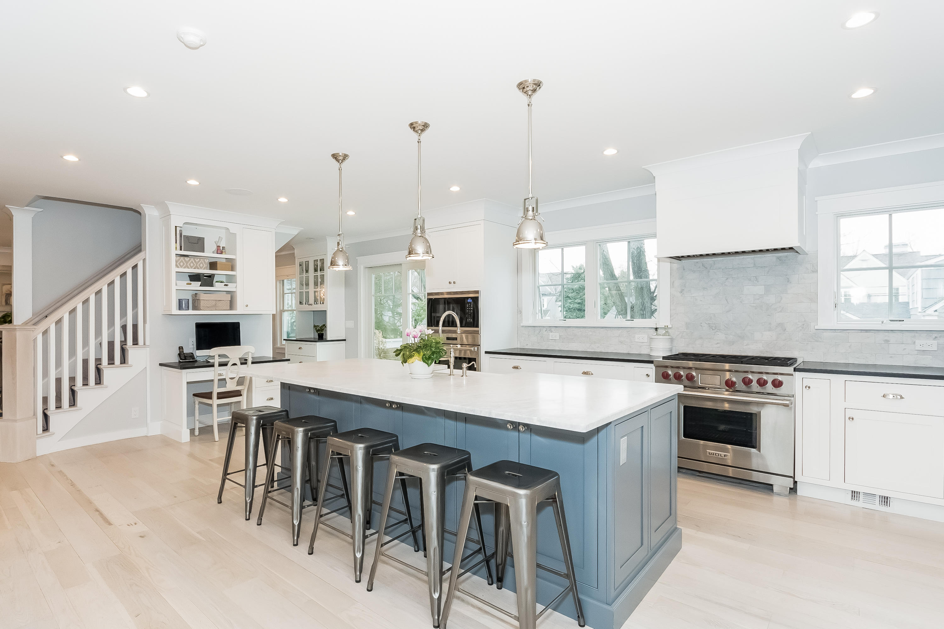 20 Plymouth Road Darien, CT 06820 - Photo 10 of 46 a kitchen with kitchen island a stove a table and chairs in it