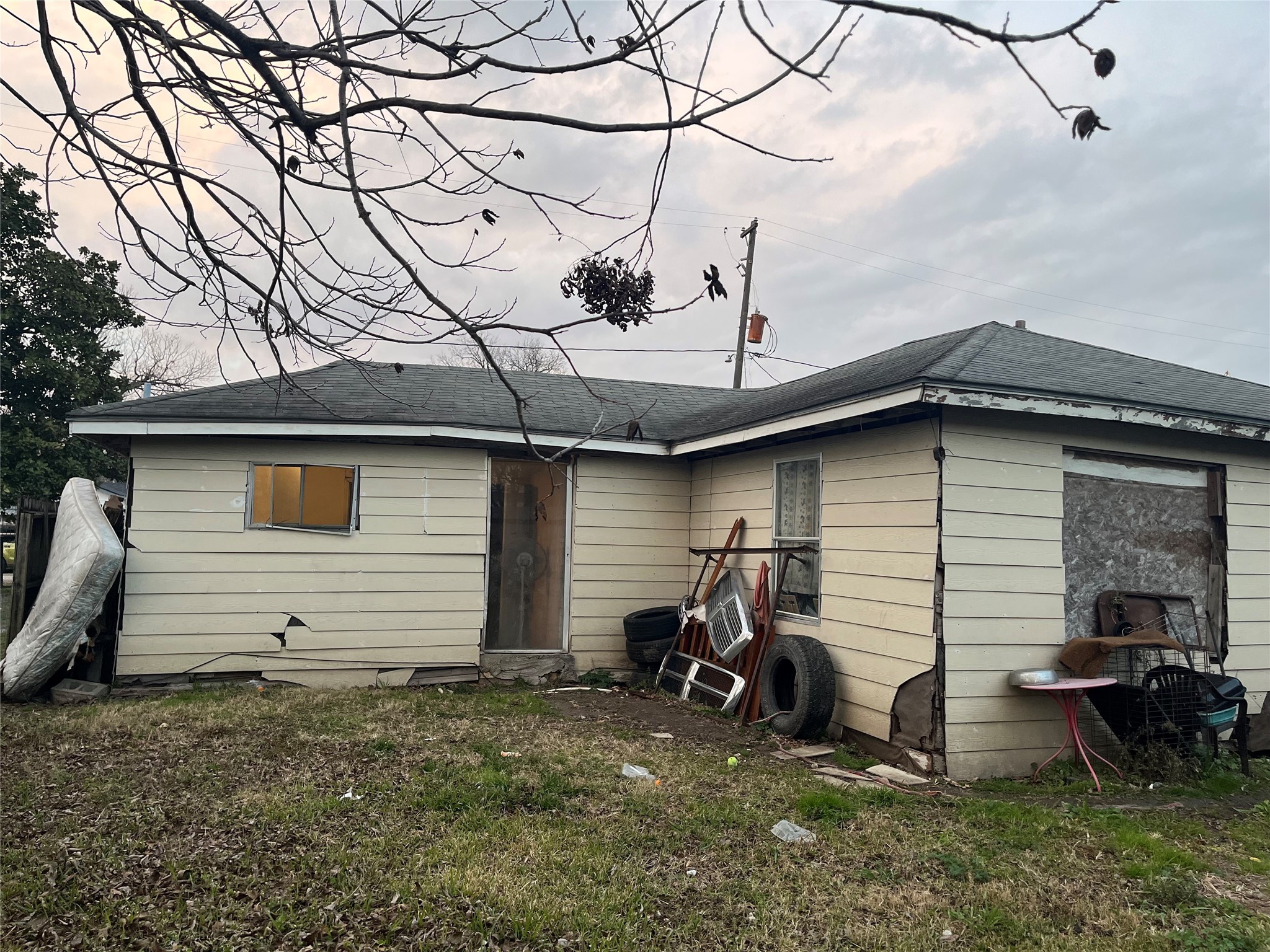 8016 Munn Street Houston, TX 77029 - Photo 2 of 24 a view of a house with a yard and garage