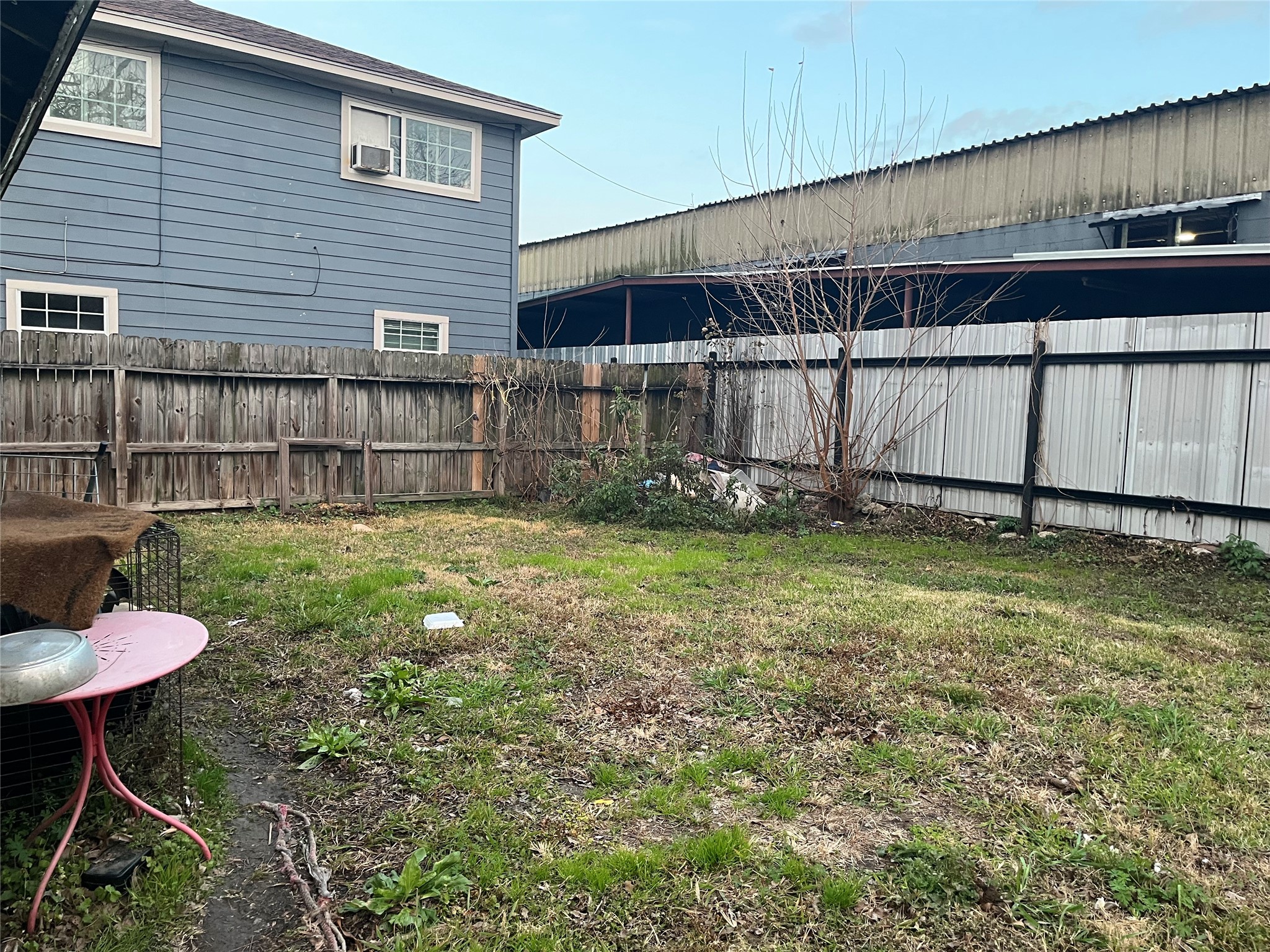 8016 Munn Street Houston, TX 77029 - Photo 4 of 24 a backyard of a house with table and chairs