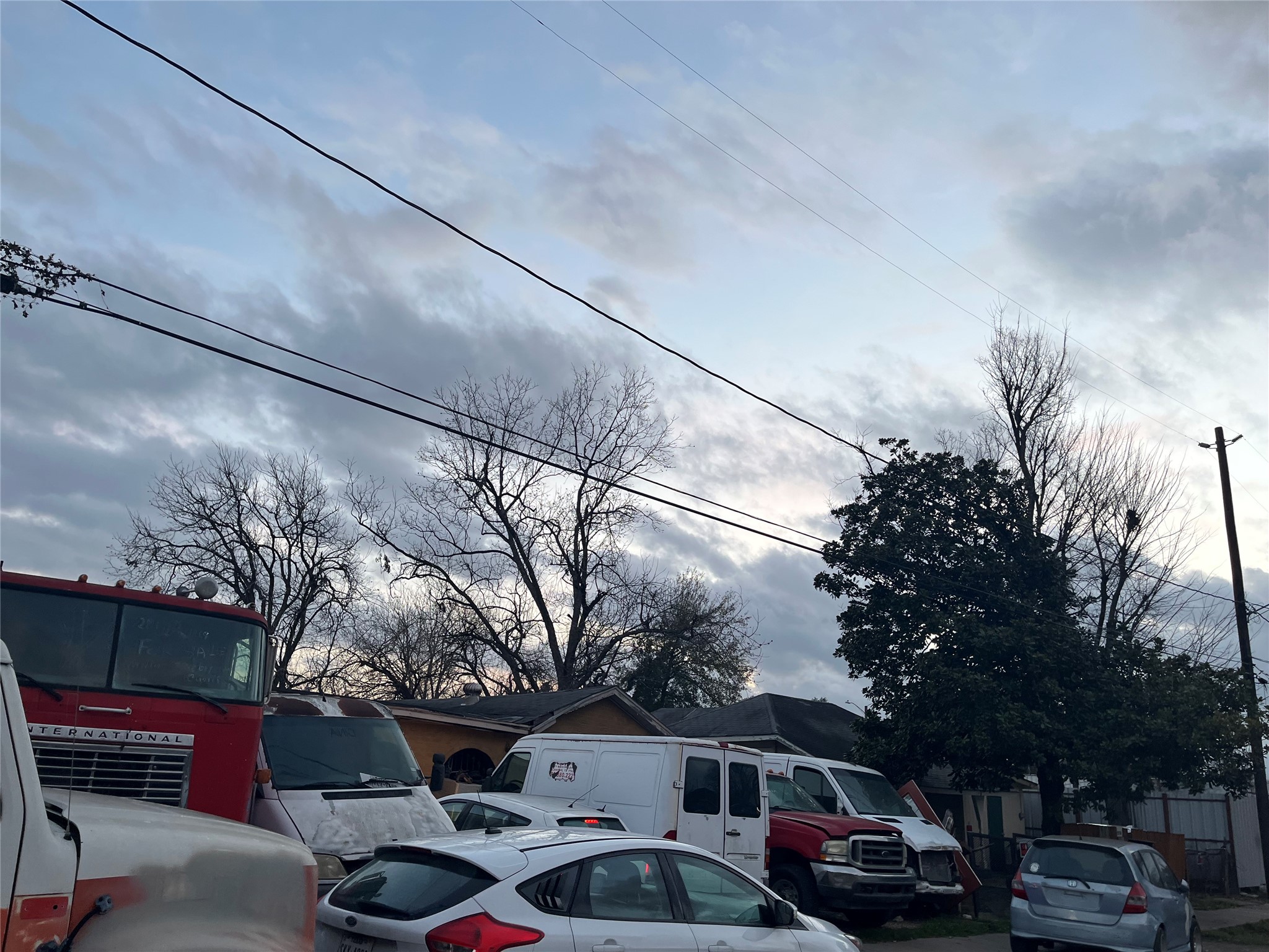 8016 Munn Street Houston, TX 77029 - Photo 10 of 24 a front view of a house with a garden and parking